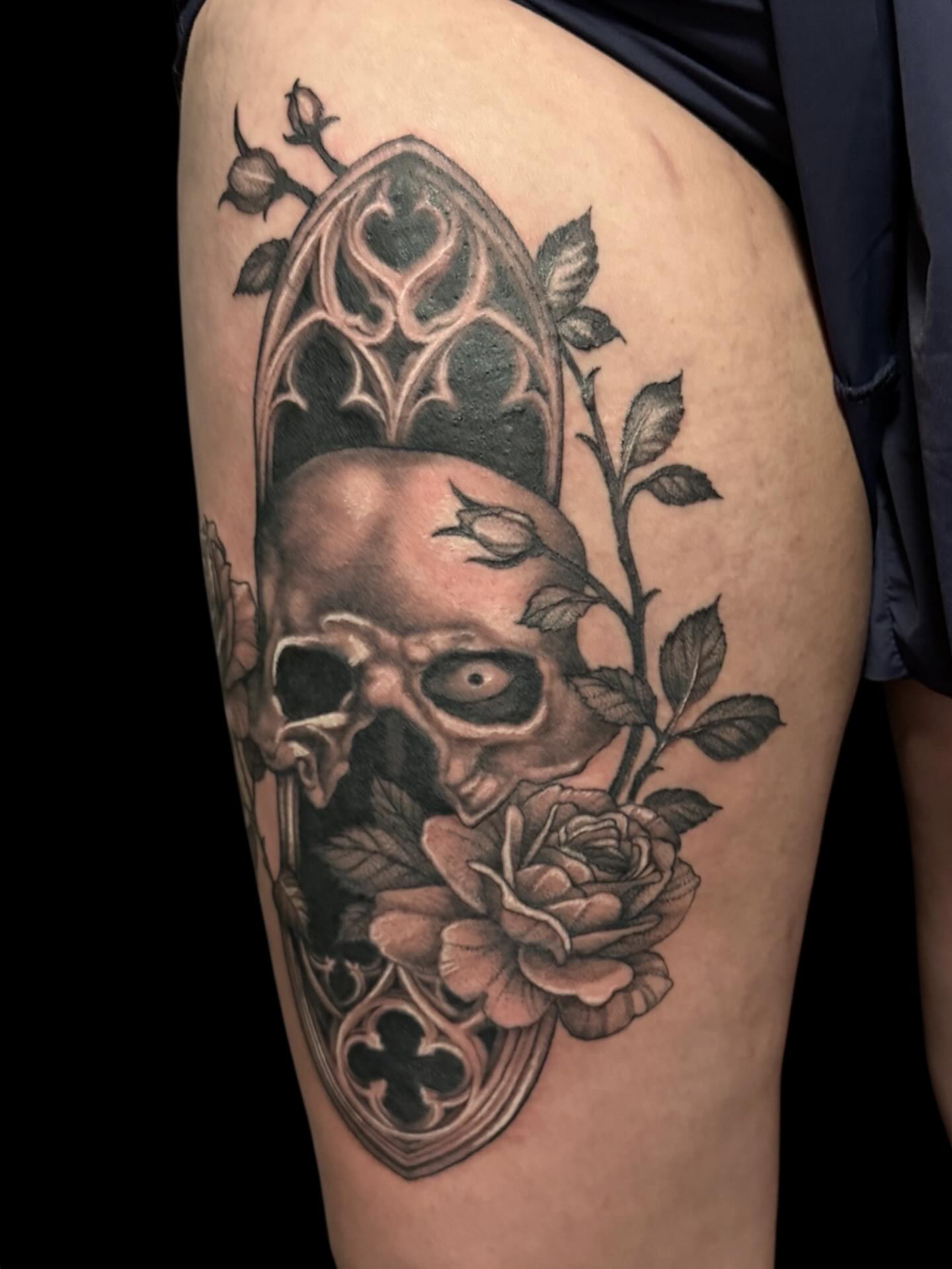 Skull and roses realism tattoo on the thigh by Brennan Walker, Orem, Utah