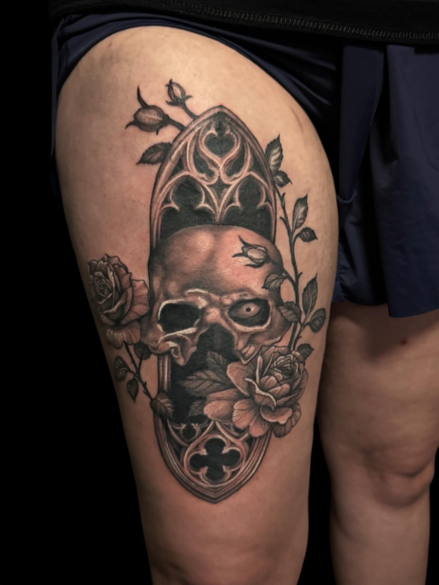 Skull and roses realism tattoo on the thigh by Brennan Walker, Orem, Utah
