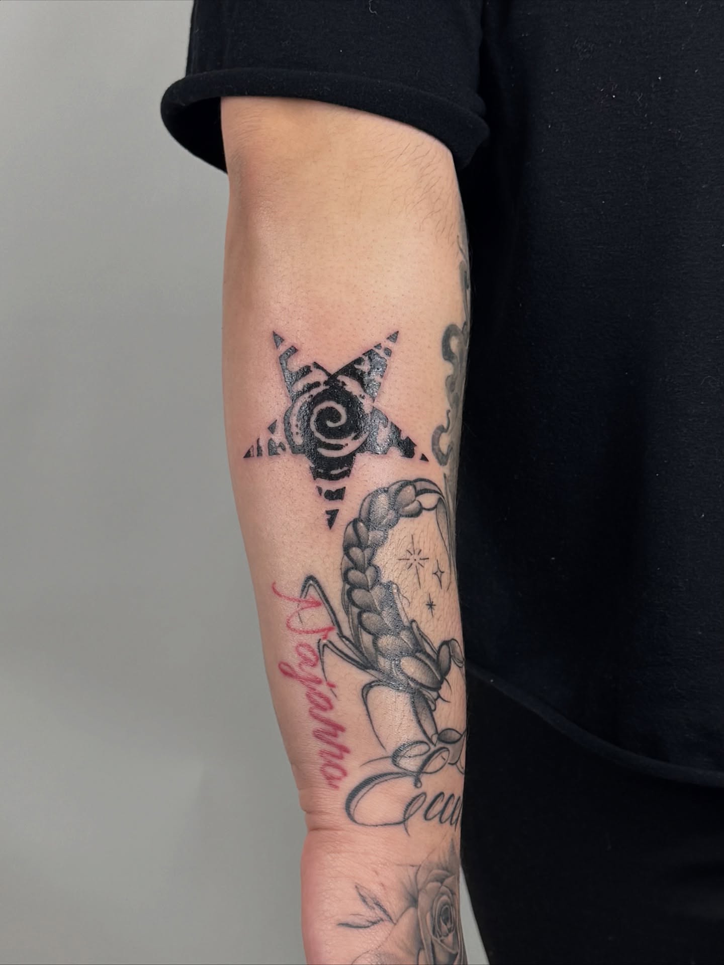 Scorpion and rose black and grey tattoo on the forearm by sabina