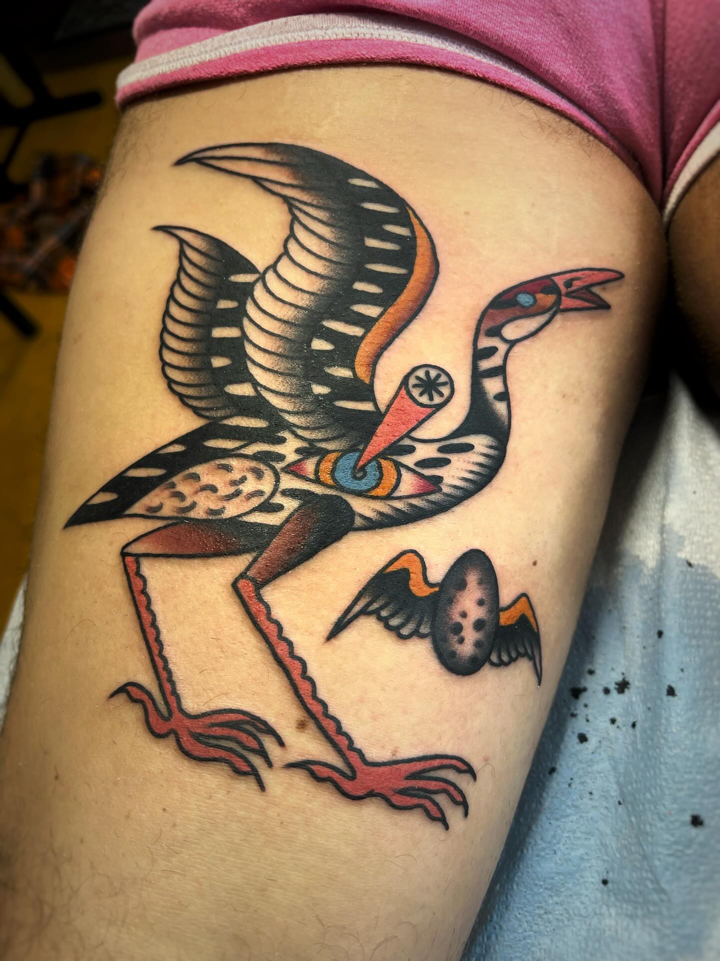 Bird American traditional tattoo on the thigh by Manee Friday