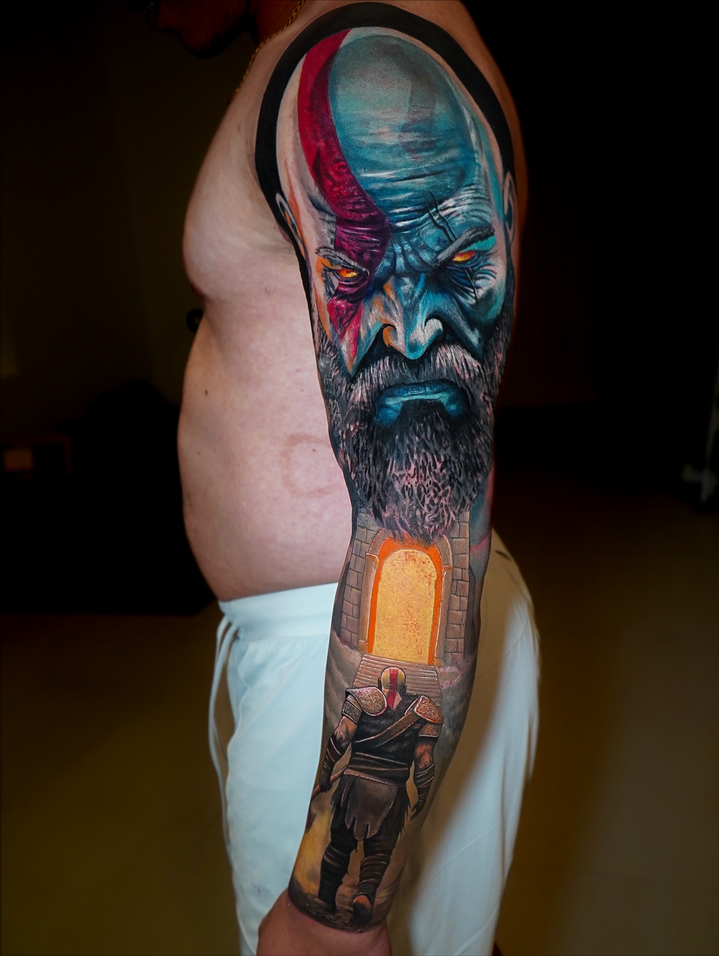Kratos realism tattoo on the forearm by Luis Gil