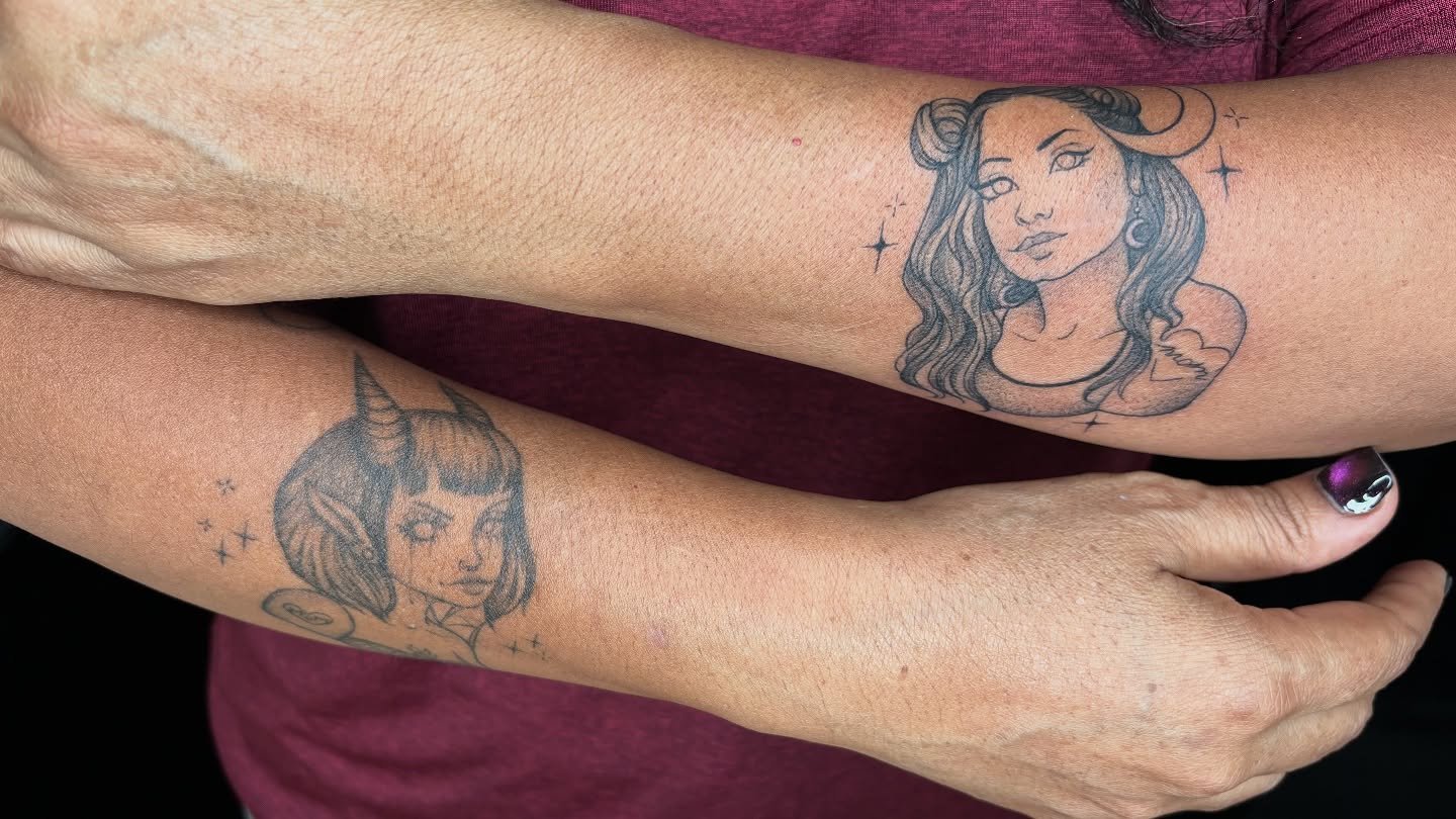 Woman with horns black and grey tattoo on the forearm by Ivanna
