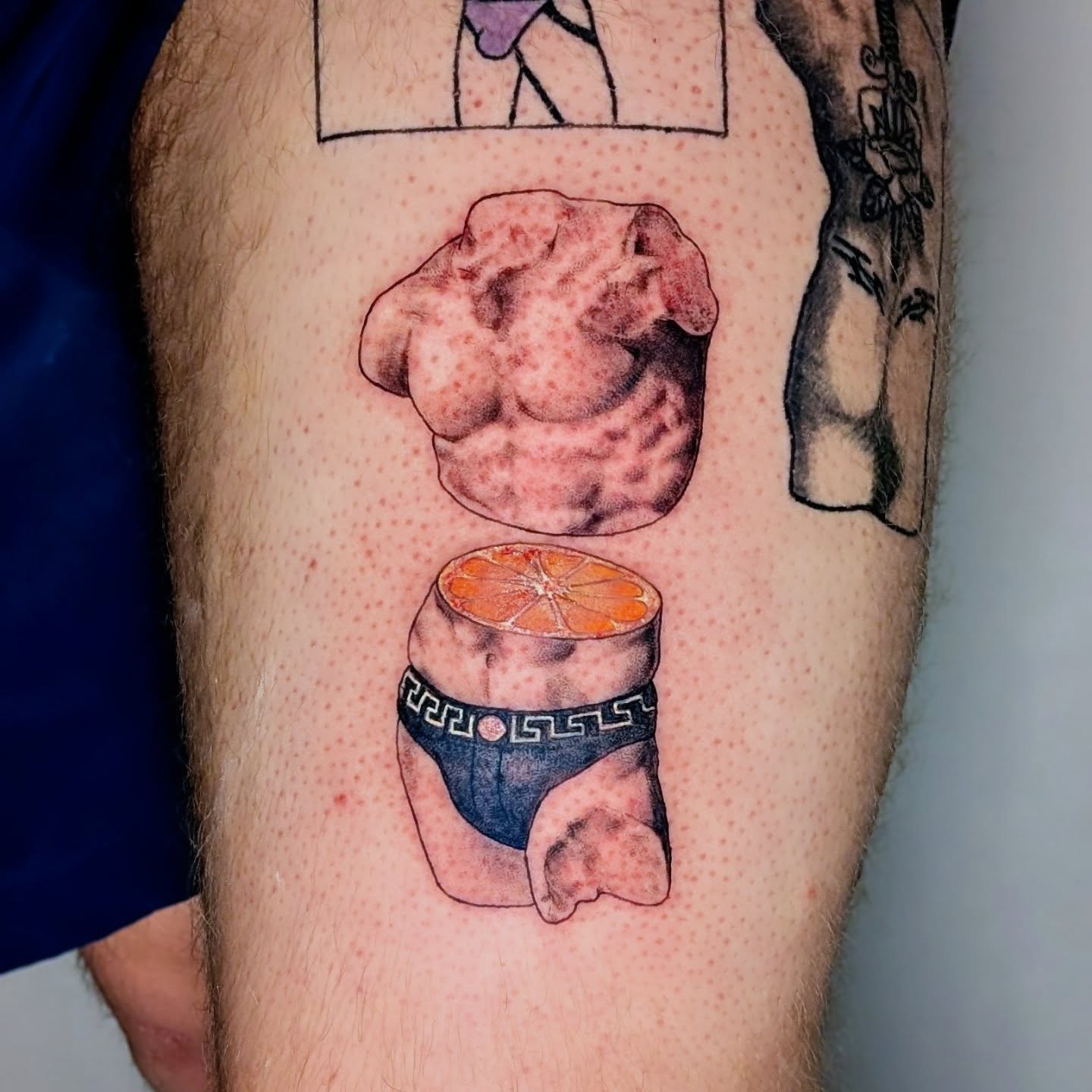 Muscle and orange slice dotwork tattoo on the thigh by Shannon