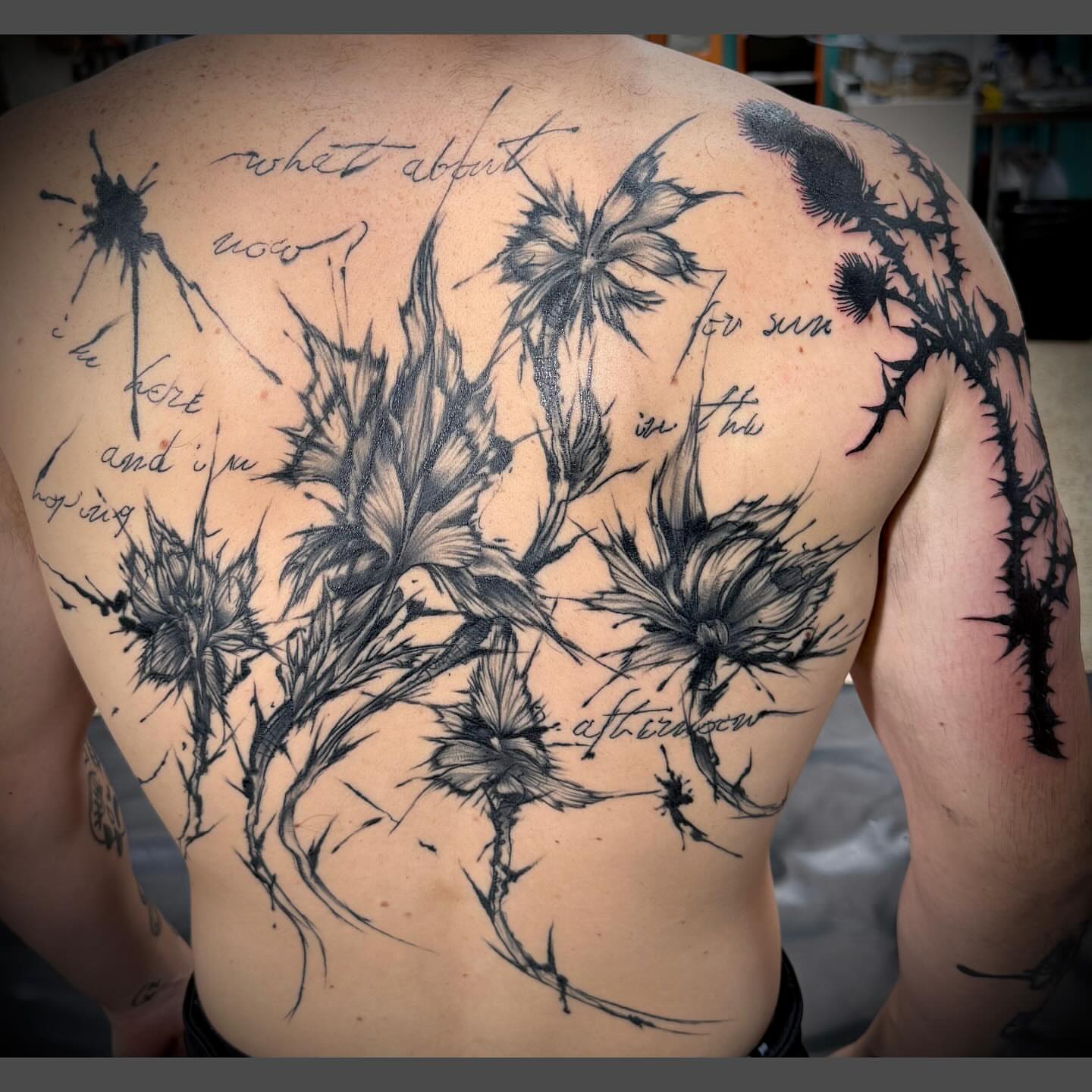 Thistle realism tattoo on the back by Richard Nagy, New Orleans, Louisiana