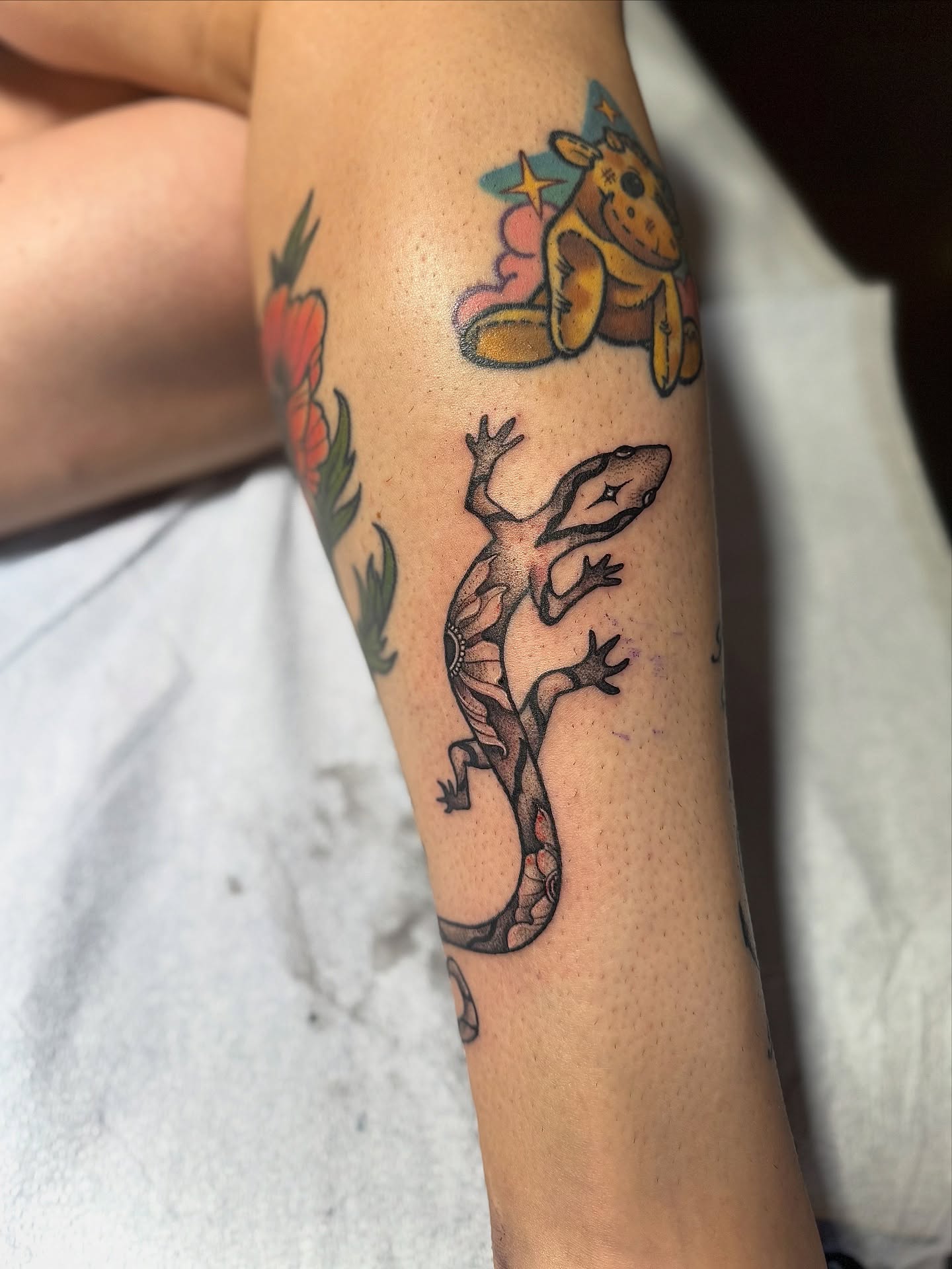 Gecko American traditional tattoo on the forearm by Jewels, St. George, Utah