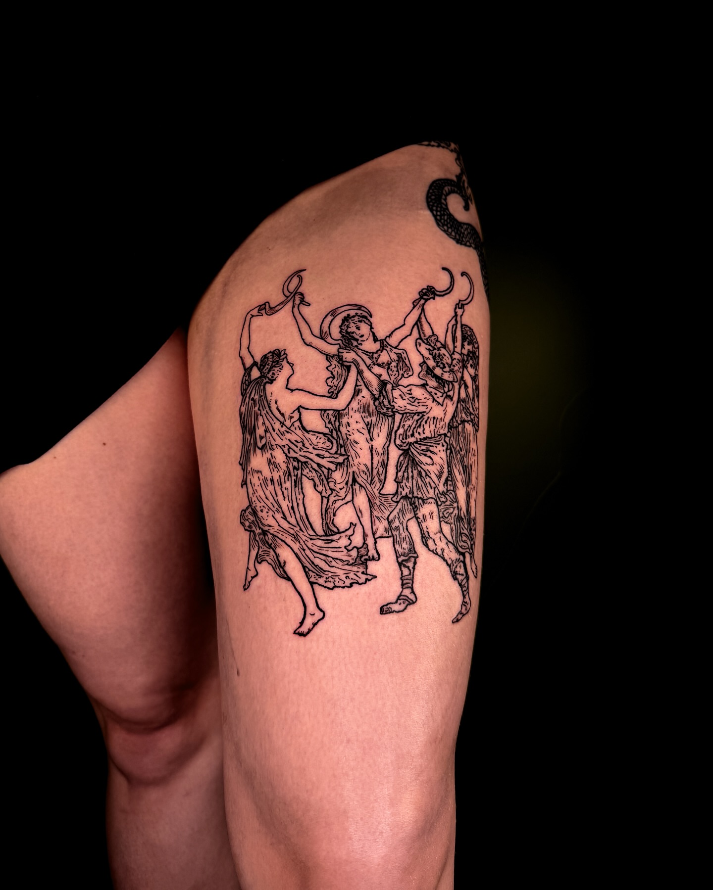Mythological figures black and grey tattoo on the upper arm by Zella Mäkelä