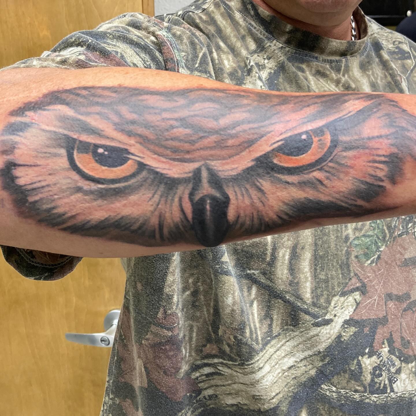 Owl realism tattoo on the forearm by Hot Dawg