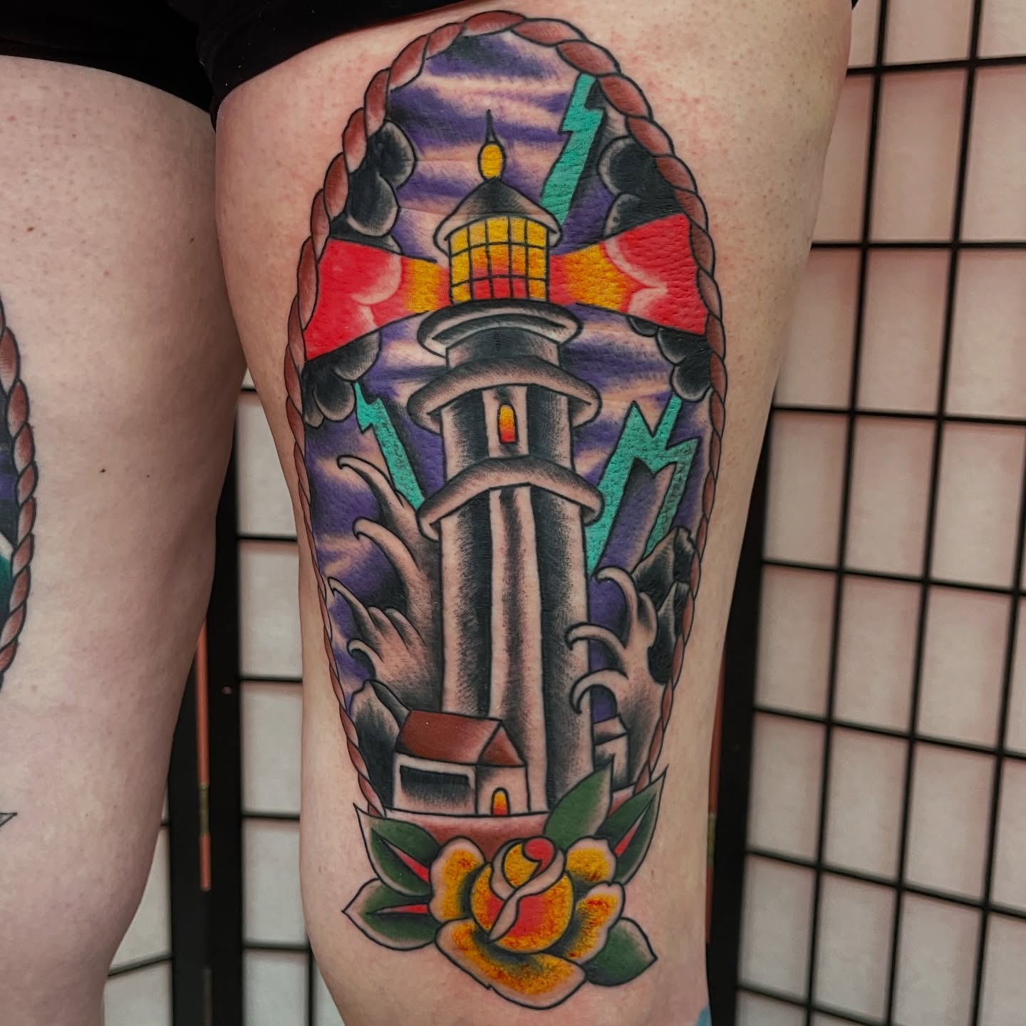 Lighthouse and rose American traditional tattoo on the thigh by adamsayre, San Diego, California