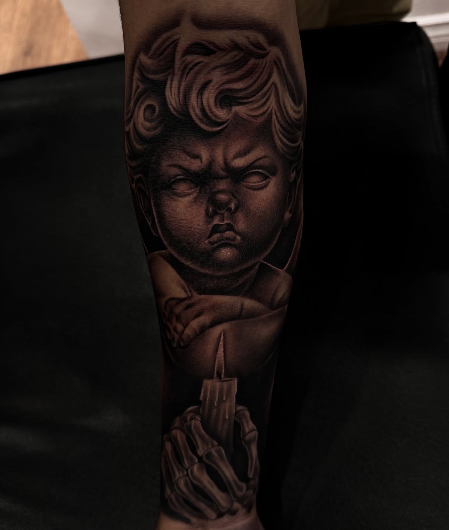Child's face realism tattoo on the forearm by Cesar Nava