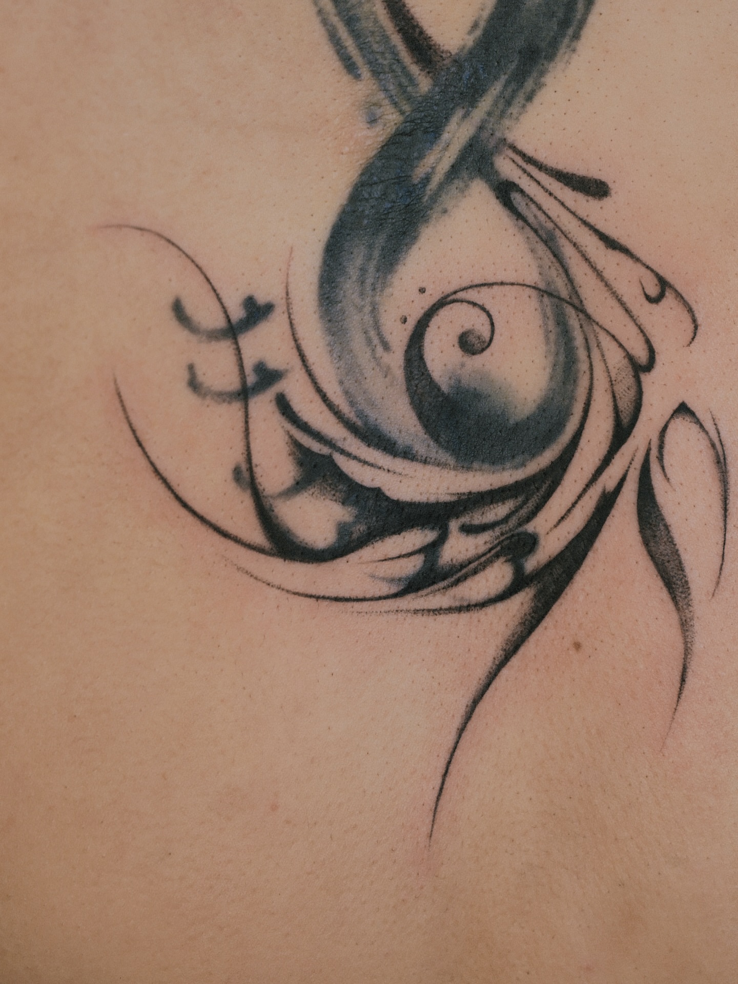 Eye black and grey tattoo on the shoulder by Max