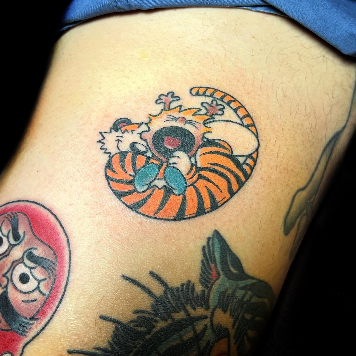 Calvin and hobbes American traditional tattoo on the thigh by @sloanxkettering