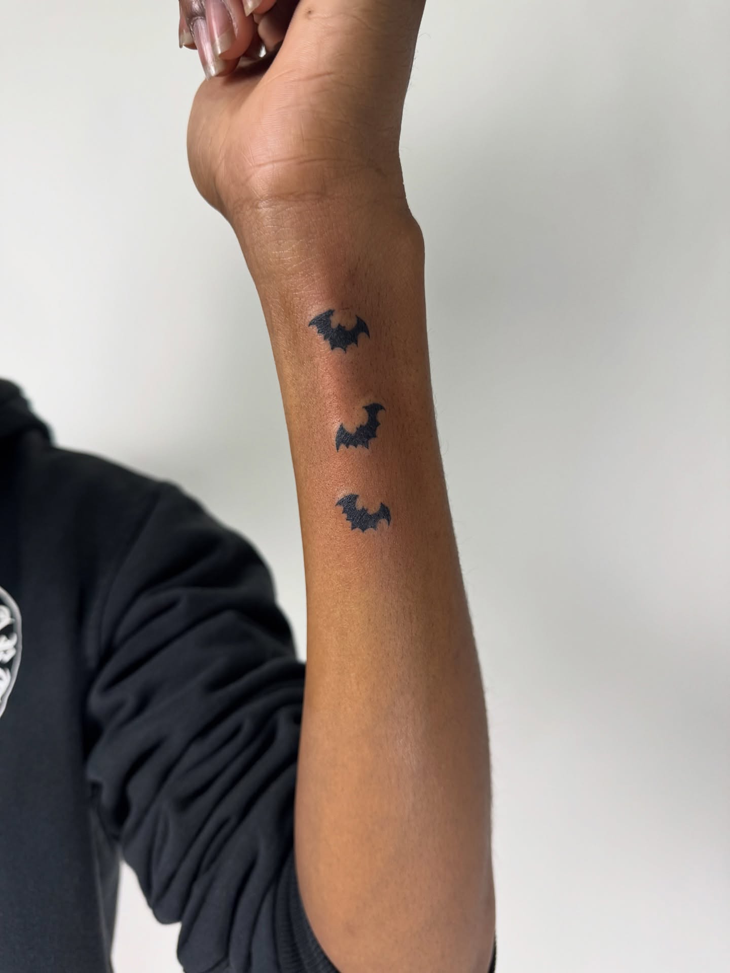 Bat black and grey tattoo on the forearm by sabina