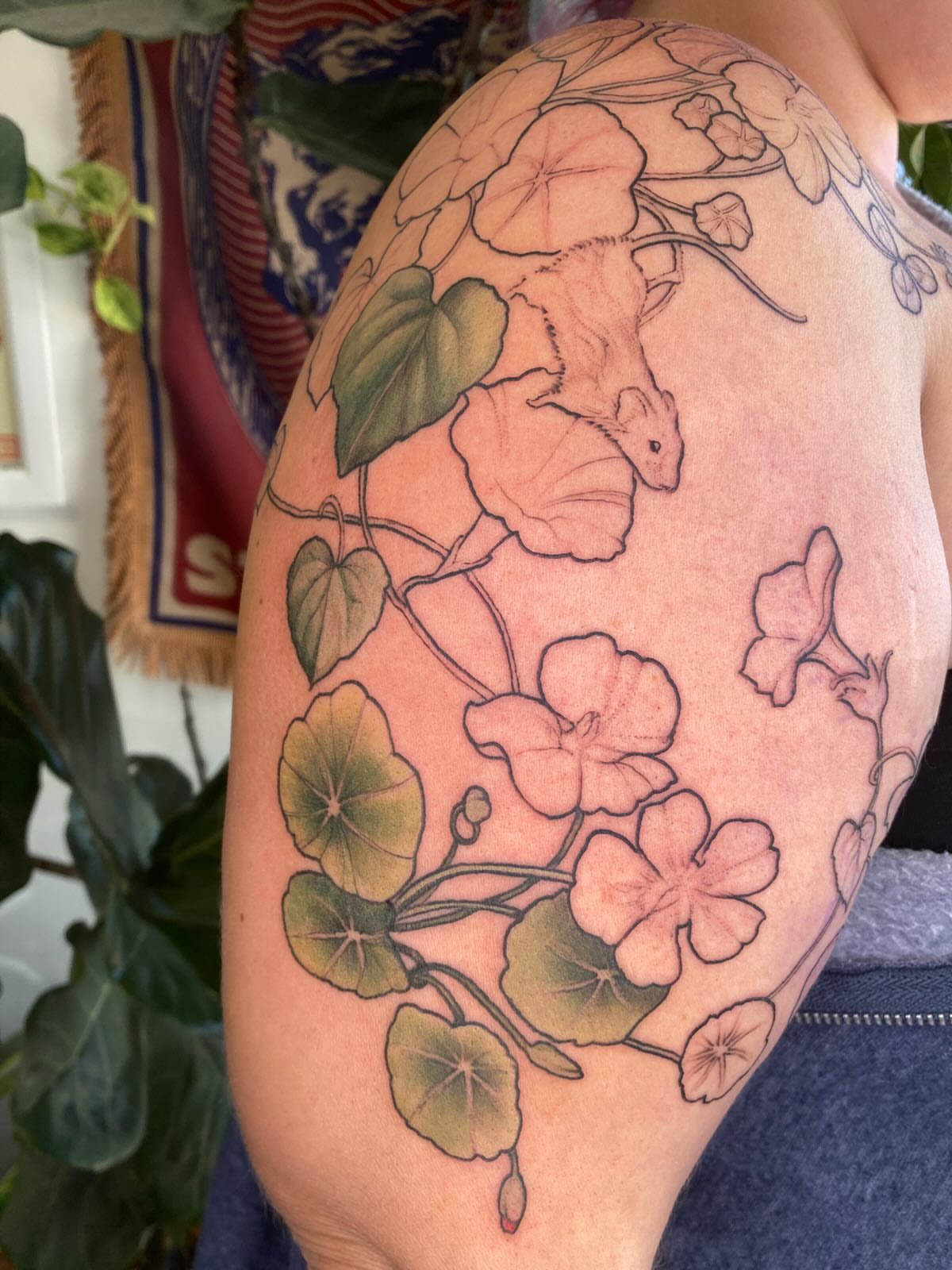 Mouse and flowers illustrative tattoo on the shoulder by Amber Miracle