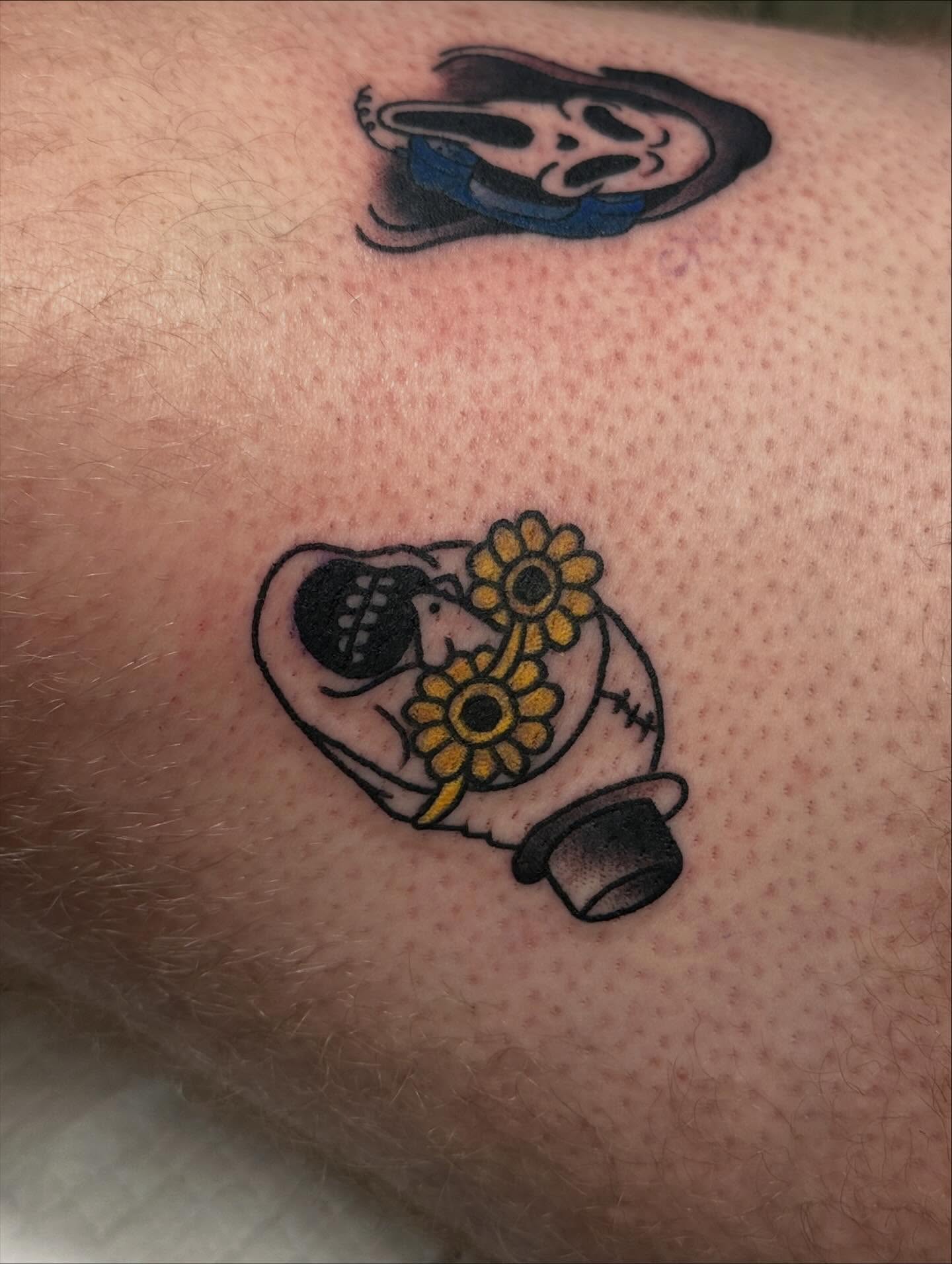 Scream mask and sunflowers American traditional tattoo on the forearm by Tattoo artist