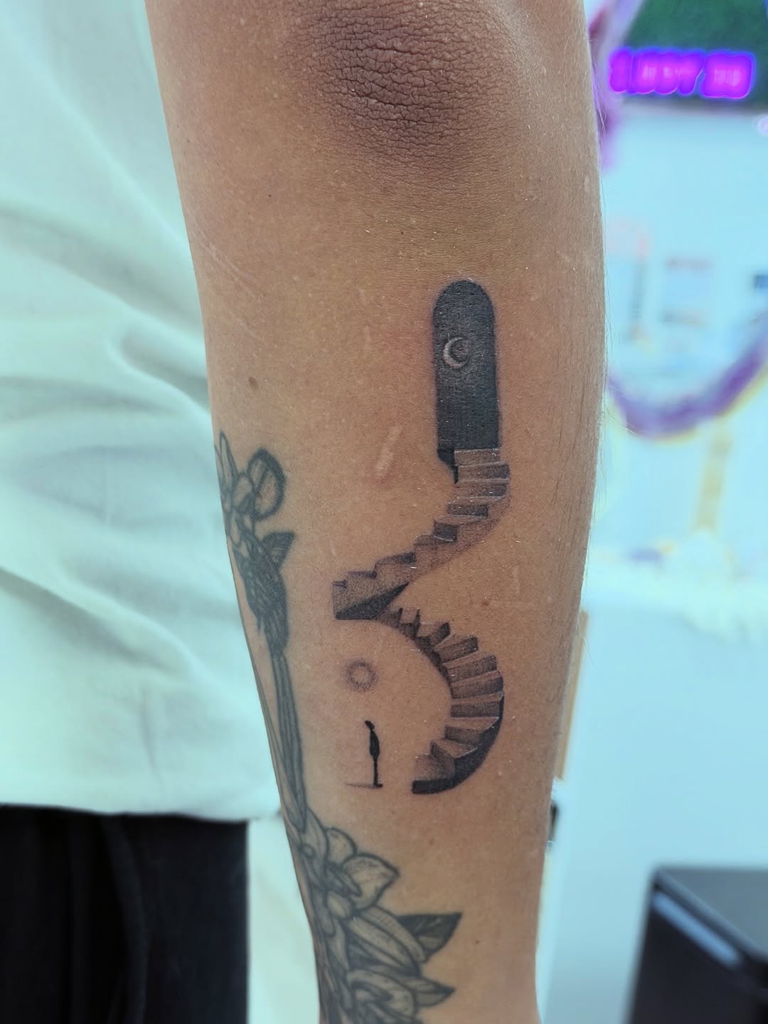 Doorway with stairs and a person minimalist tattoo on the forearm by Ink About Me - Amanda’s Fine Lines