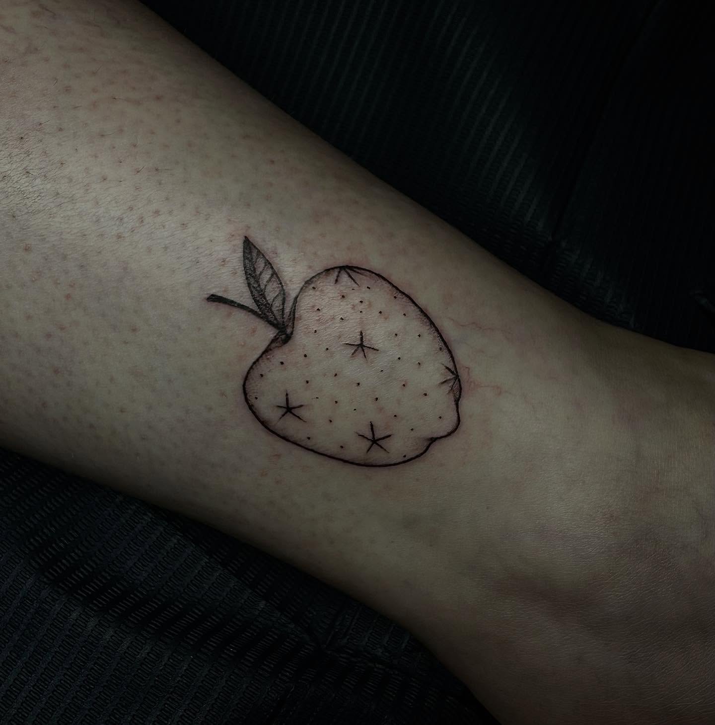 Strawberry dotwork tattoo on the forearm by emma christine