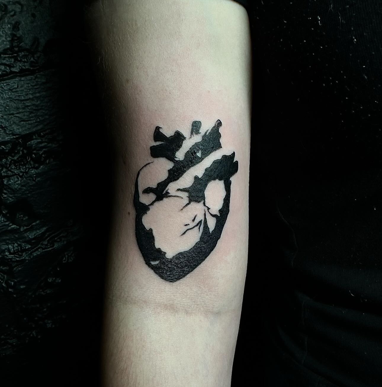 Anatomical heart black and grey tattoo on the forearm by emma christine