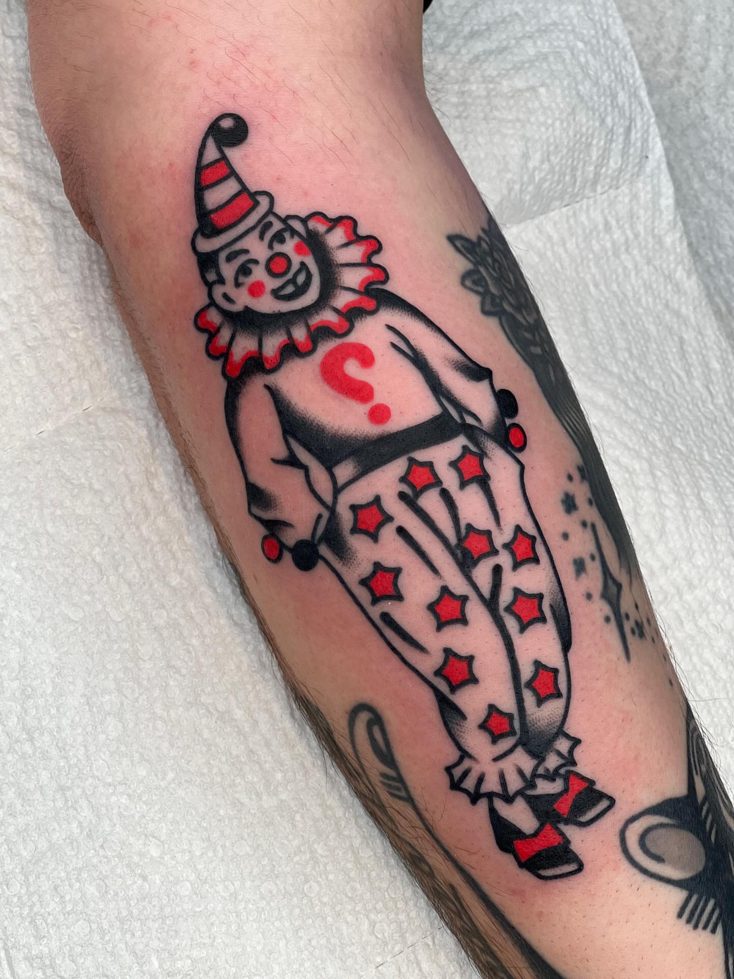 Clown American traditional tattoo on the forearm by Blake Francis, Worcester, Massachusetts