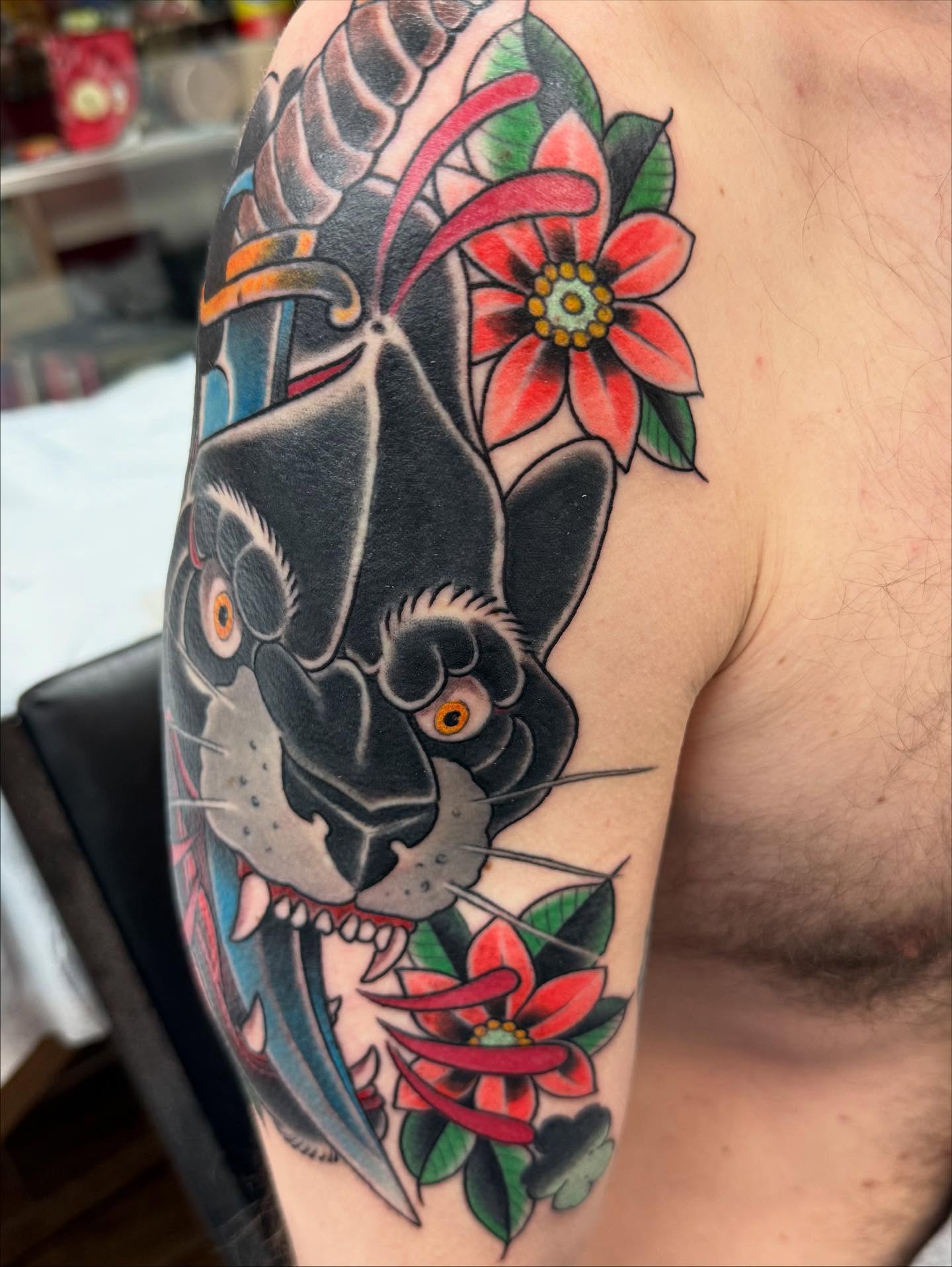 Panther and flowers American traditional tattoo on the shoulder by Hori Bensei, Charlottesville, Virginia