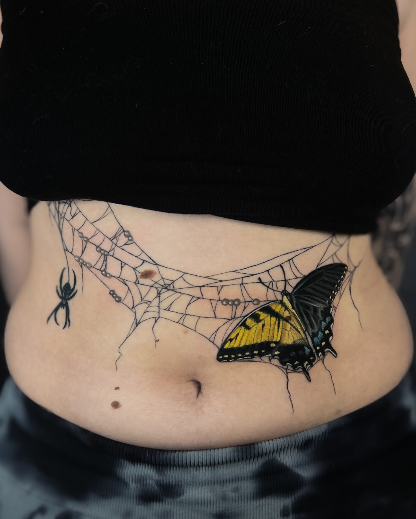 Butterfly and spider web realism tattoo on the torso by 𝖃𝖆𝖓𝖉𝖗𝖎𝖆 ✦ ᴏʀᴇɢᴏɴ ᴛᴀᴛᴛᴏᴏ ᴀʀᴛɪꜱᴛ