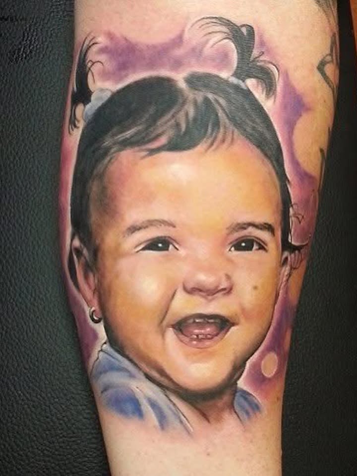 Baby portrait realism tattoo on the forearm by Jose Carlos
