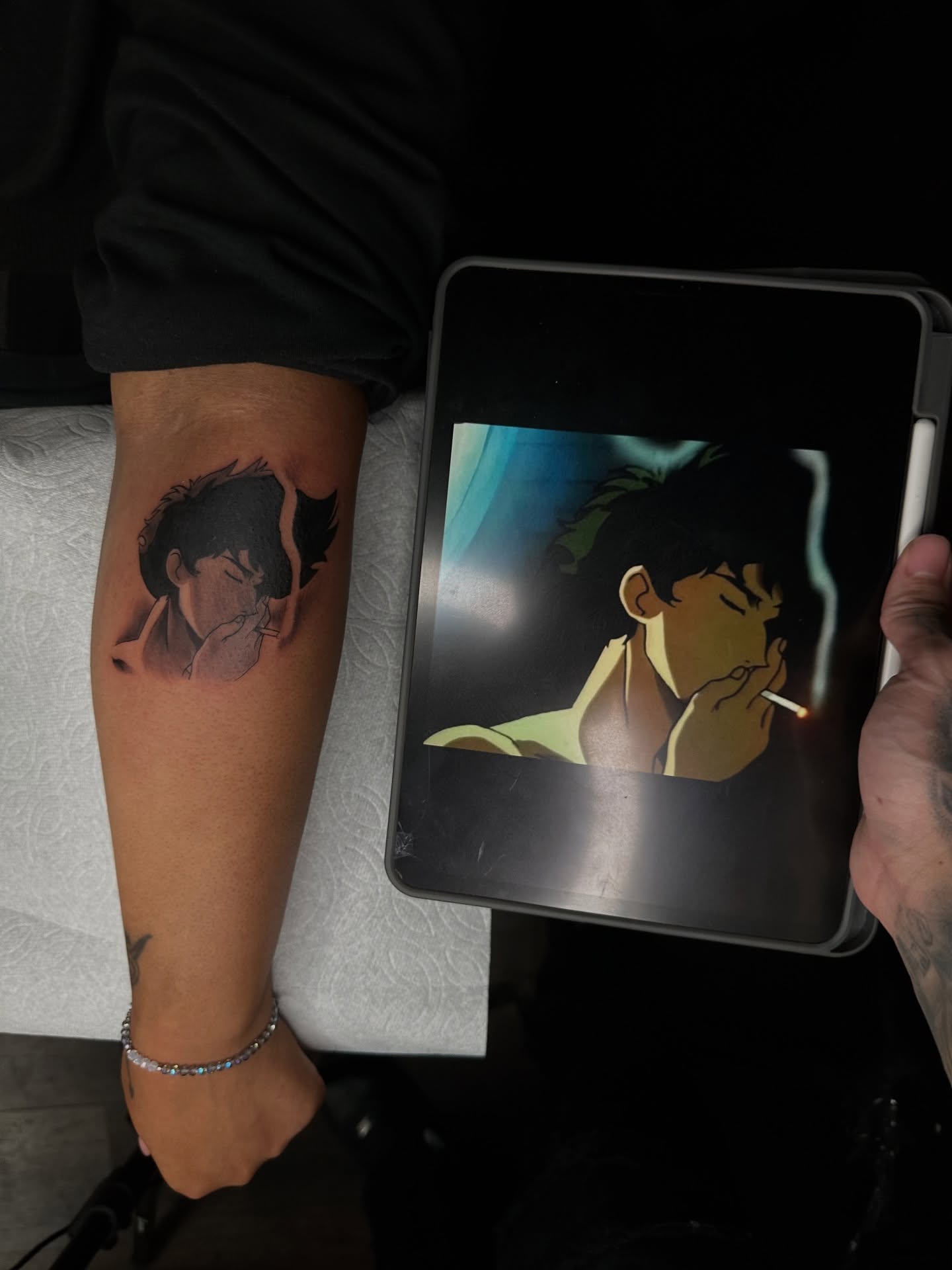 Smoking man anime tattoo on the forearm by Mando
