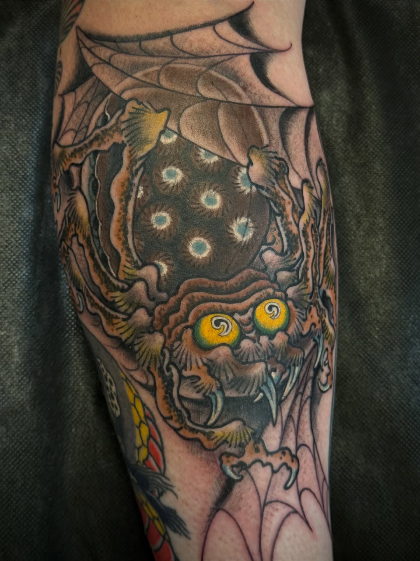 Monster dotwork tattoo on the forearm by Candi Kinyōbi