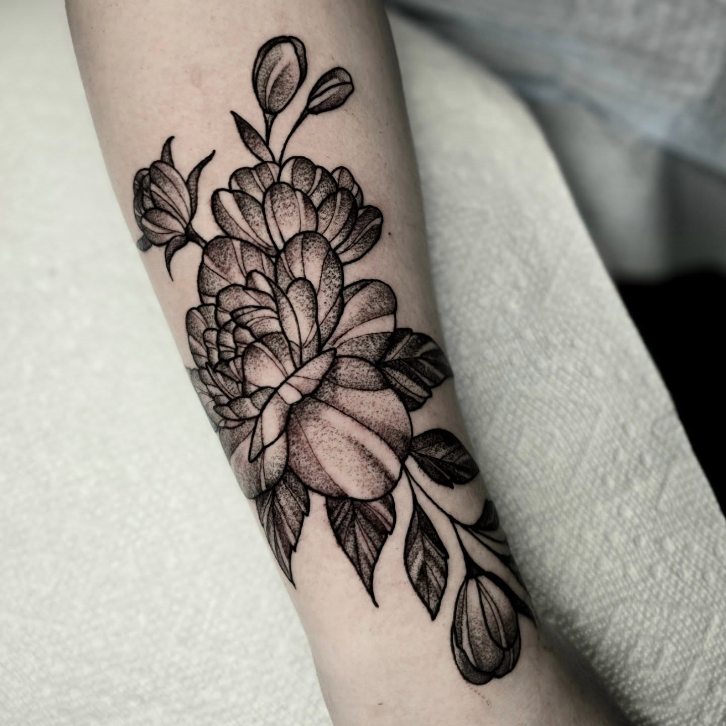 Peony dotwork tattoo on the forearm by Adison Essig