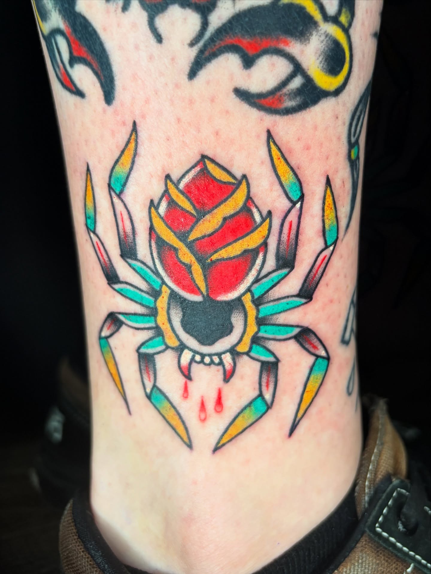 Spider American traditional tattoo on the forearm by Josh Johns