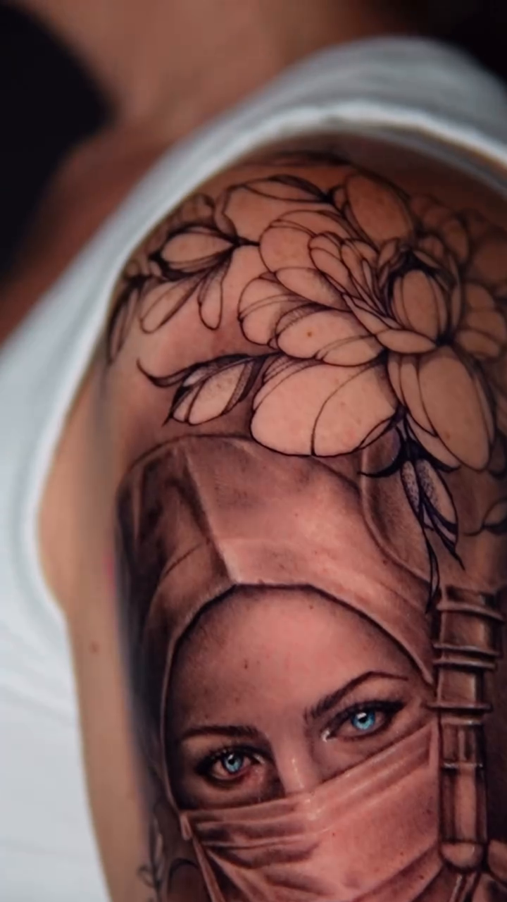 Woman with mask and flowers realism tattoo by Mariella Elizabeth Paul ππ€