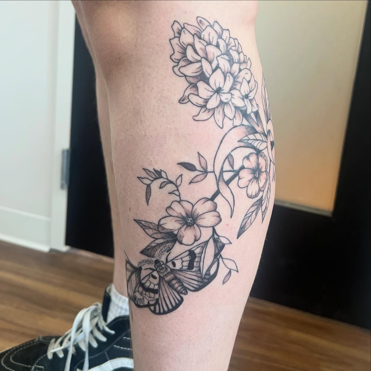 Flowers and moth black and grey tattoo on the forearm by 🍄‍🟫🍄Moth🍄🍄‍🟫