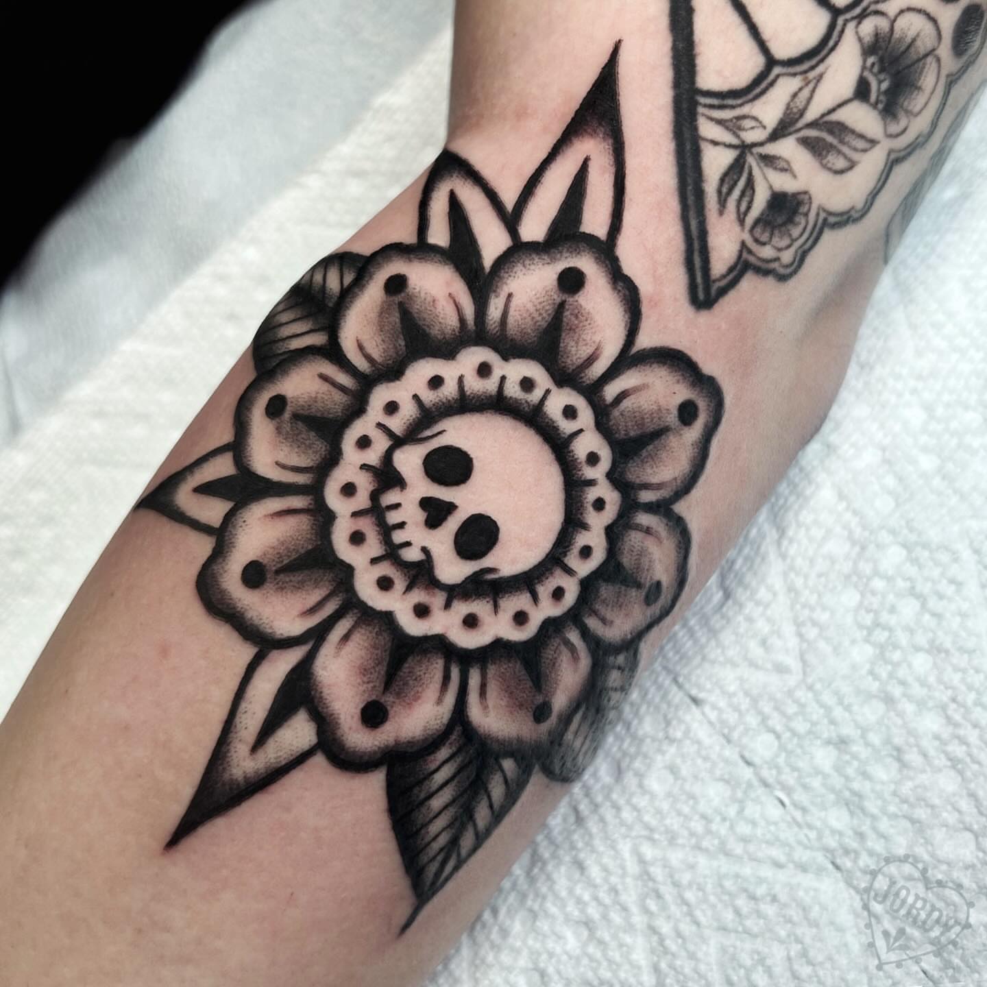 Flower with skull American traditional tattoo on the forearm by jordy, Philadelphia, Pennsylvania