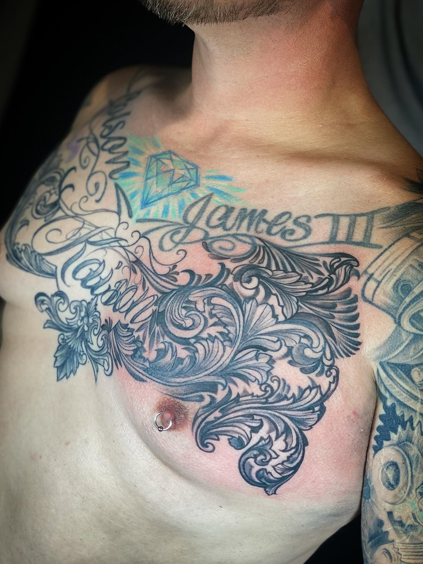 Ornamental design ornamental tattoo on the chest by Chris Klee