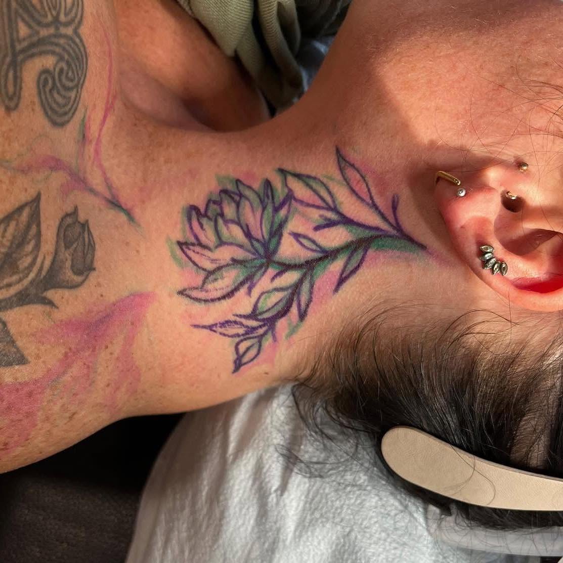 Flower new school tattoo on the neck by Shelly Elissa Tattoos