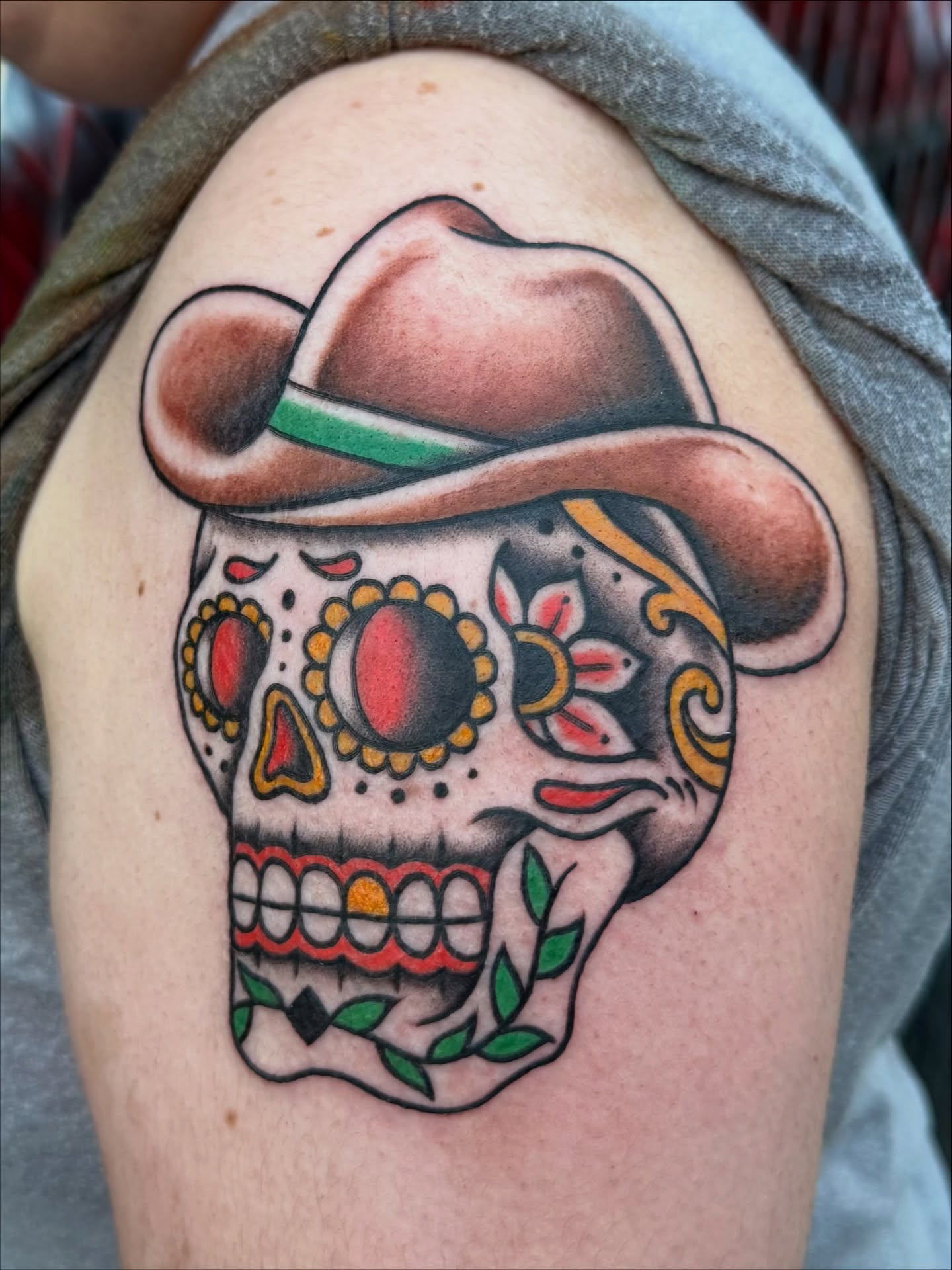Sugar skull American traditional tattoo on the shoulder by 𝕯𝖗𝖆𝕶𝖊㋛