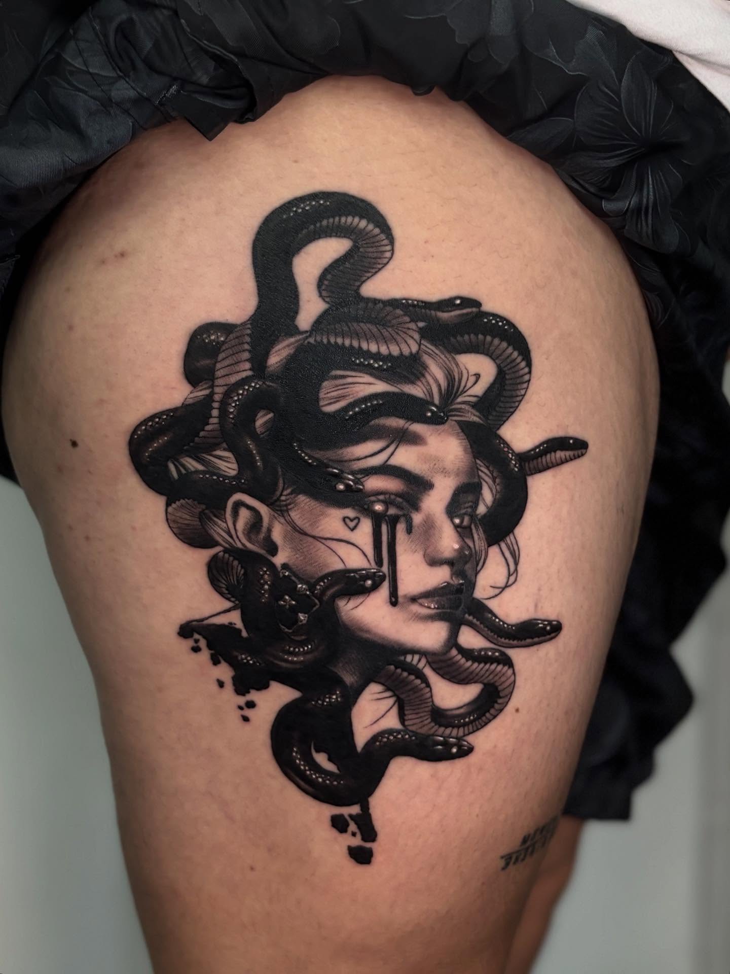 Medusa dark realism tattoo on the thigh by Tattoos by Tessa
