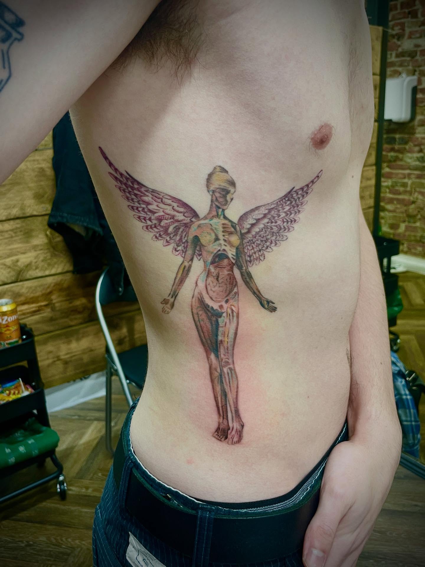 Anatomical angel realism tattoo on the ribs by Grace derby tattooist, Derby