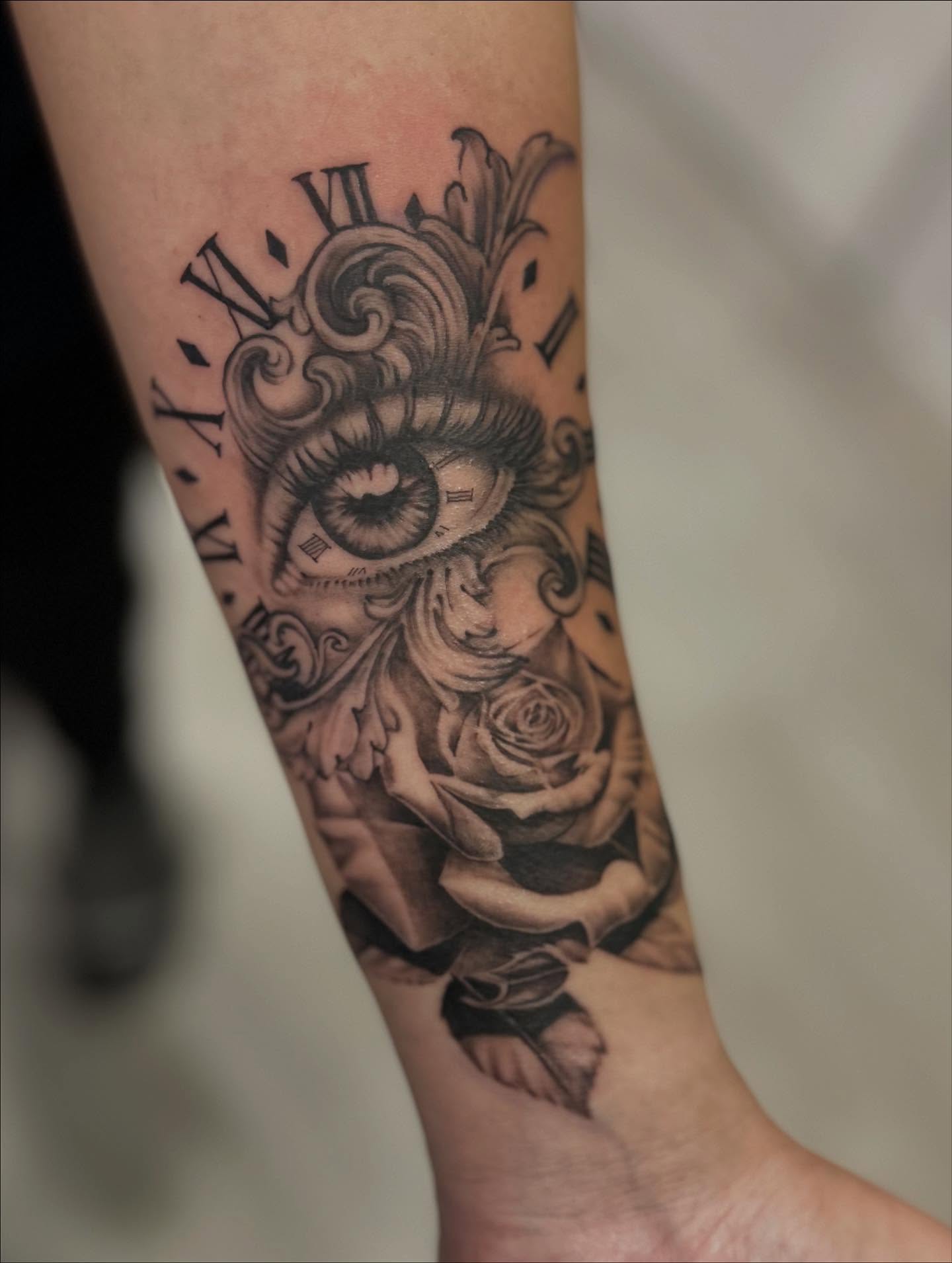 Eye and clock realism tattoo on the forearm by Jbtattoo Artistry