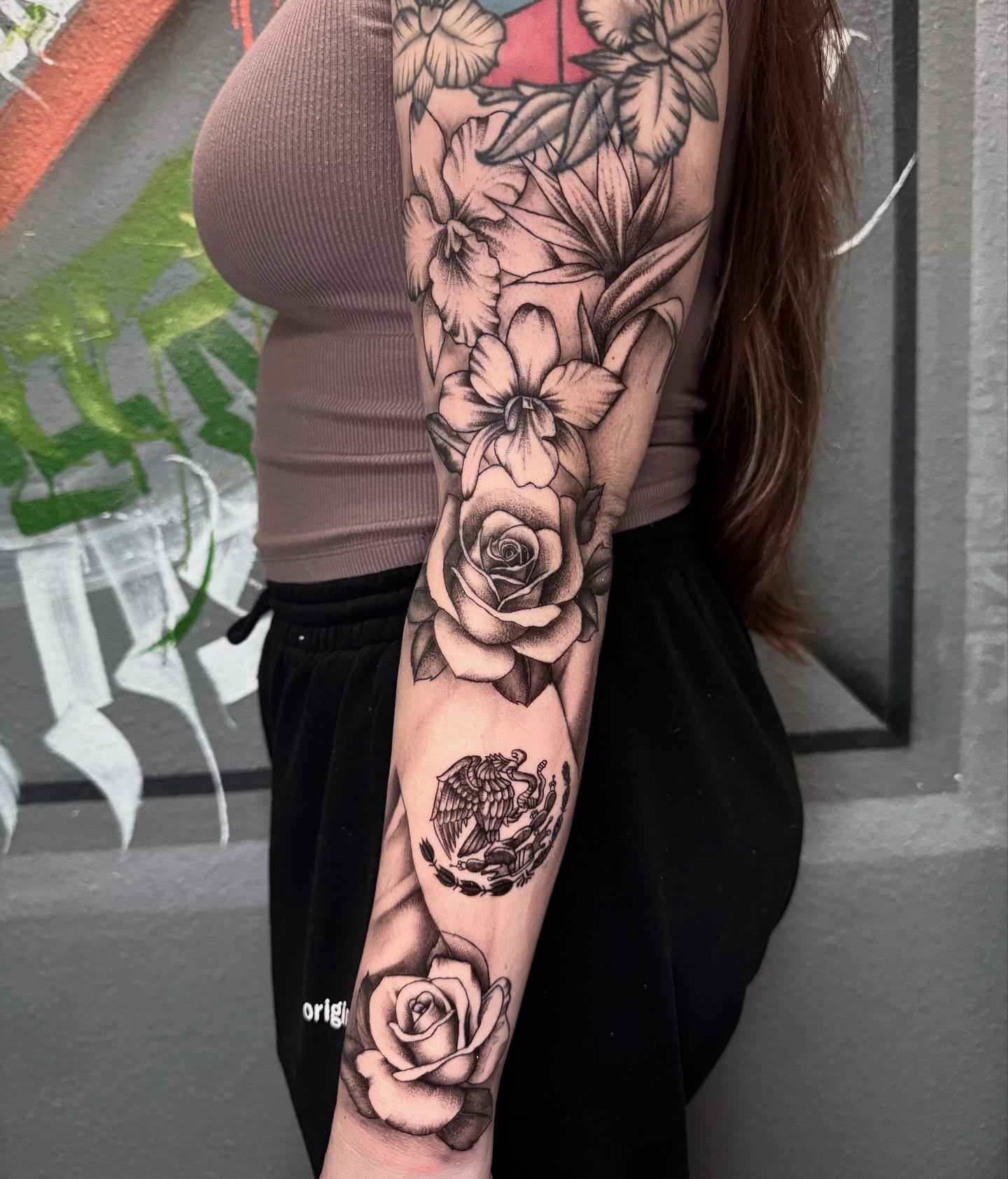Roses and eagle realism tattoo on the forearm by Jess
