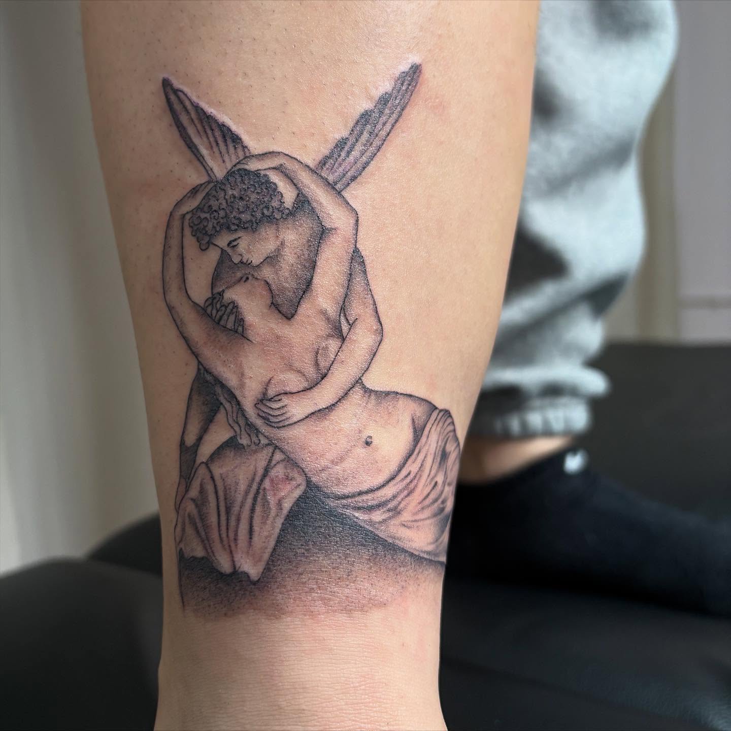 Kissing couple realism tattoo on the forearm by Jackie π€