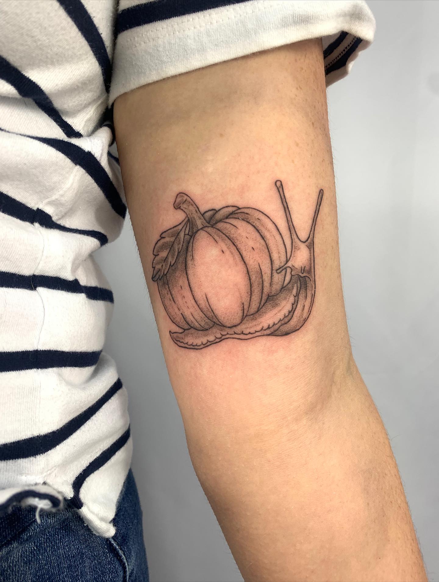 Snail with pumpkin shell realism tattoo on the forearm by ⊹ Avery Peterson ⊹