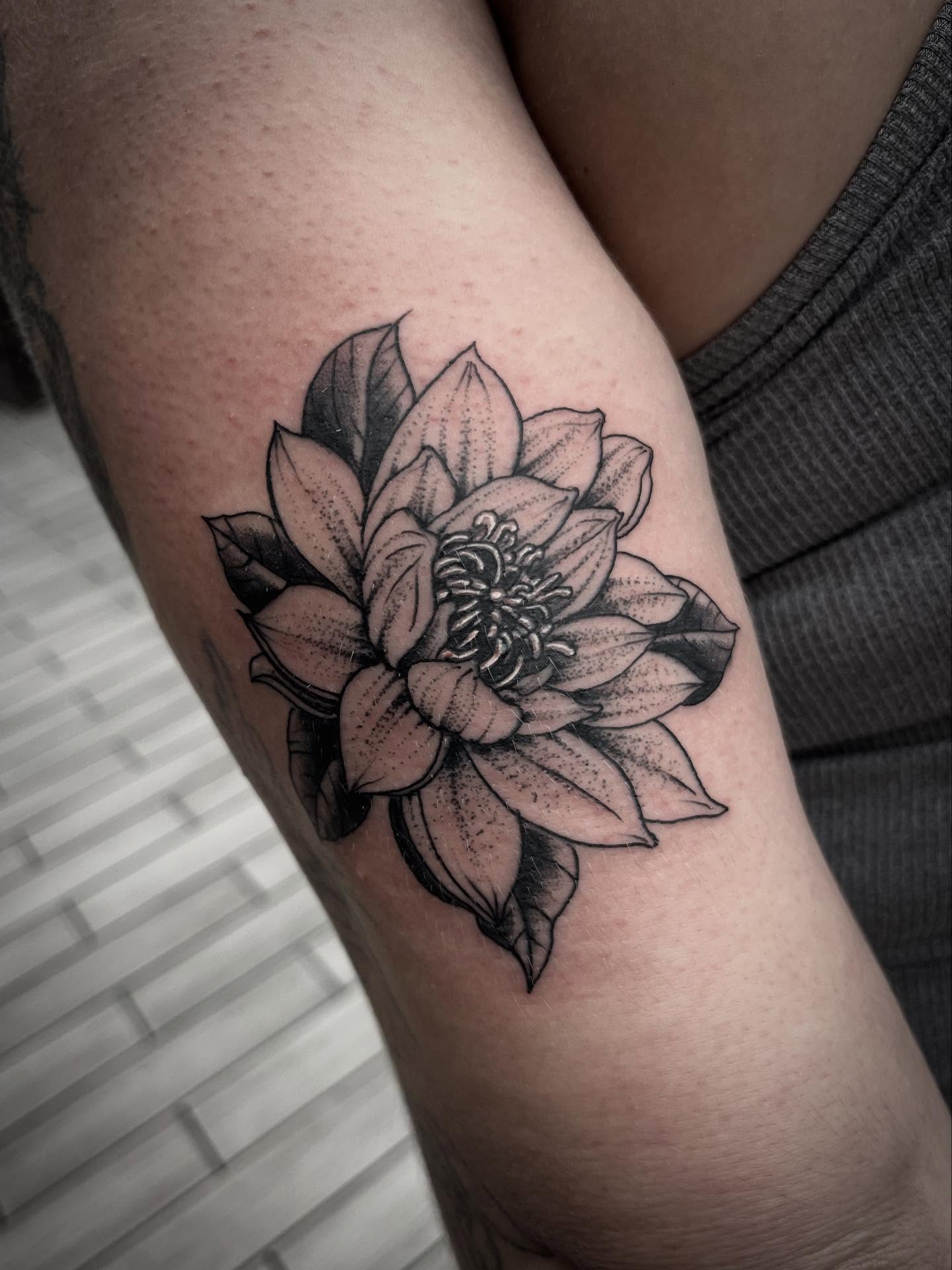 Lotus flower dotwork tattoo on the forearm by Sean Gallagher