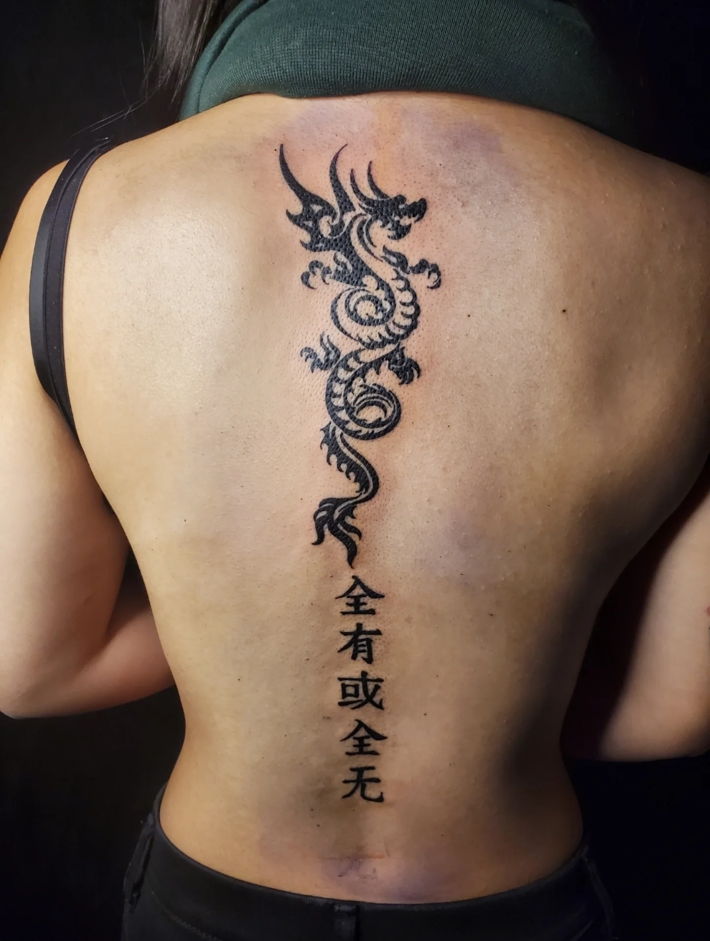 Dragon black and grey tattoo on the back by Joc