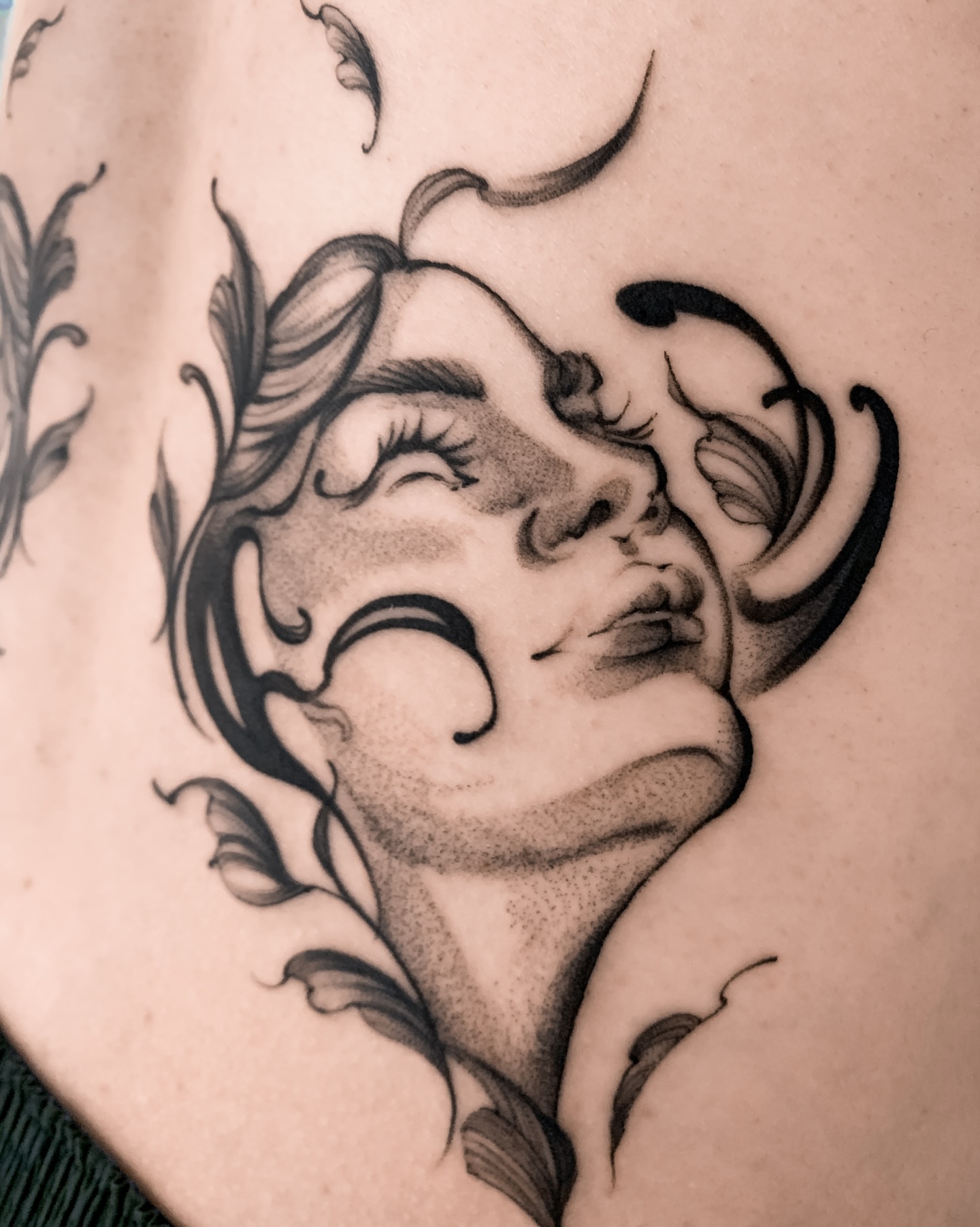 Woman's face black and grey tattoo on the shoulder by 21 tattooist