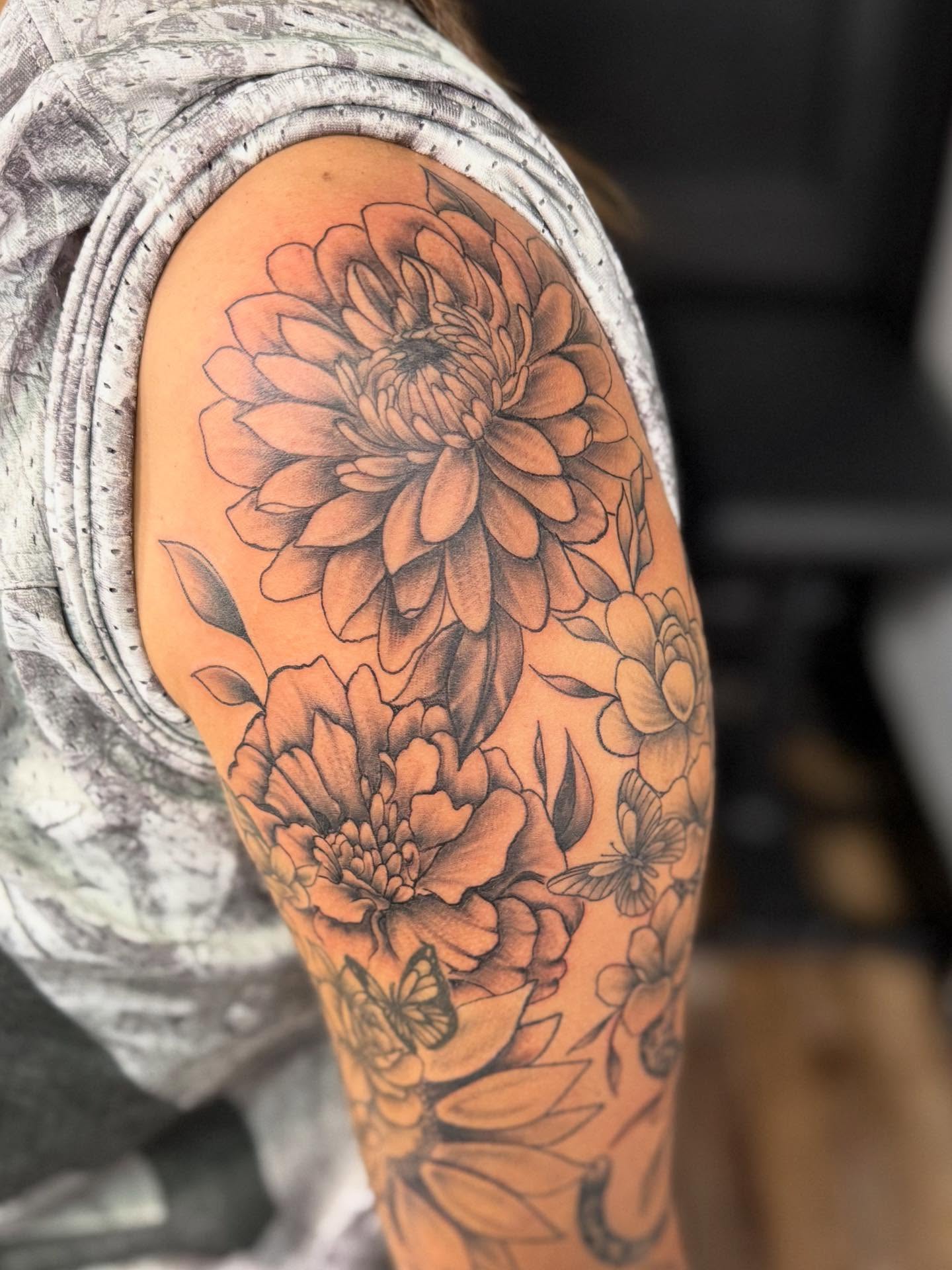Floral bouquet realism tattoo on the shoulder by AJ