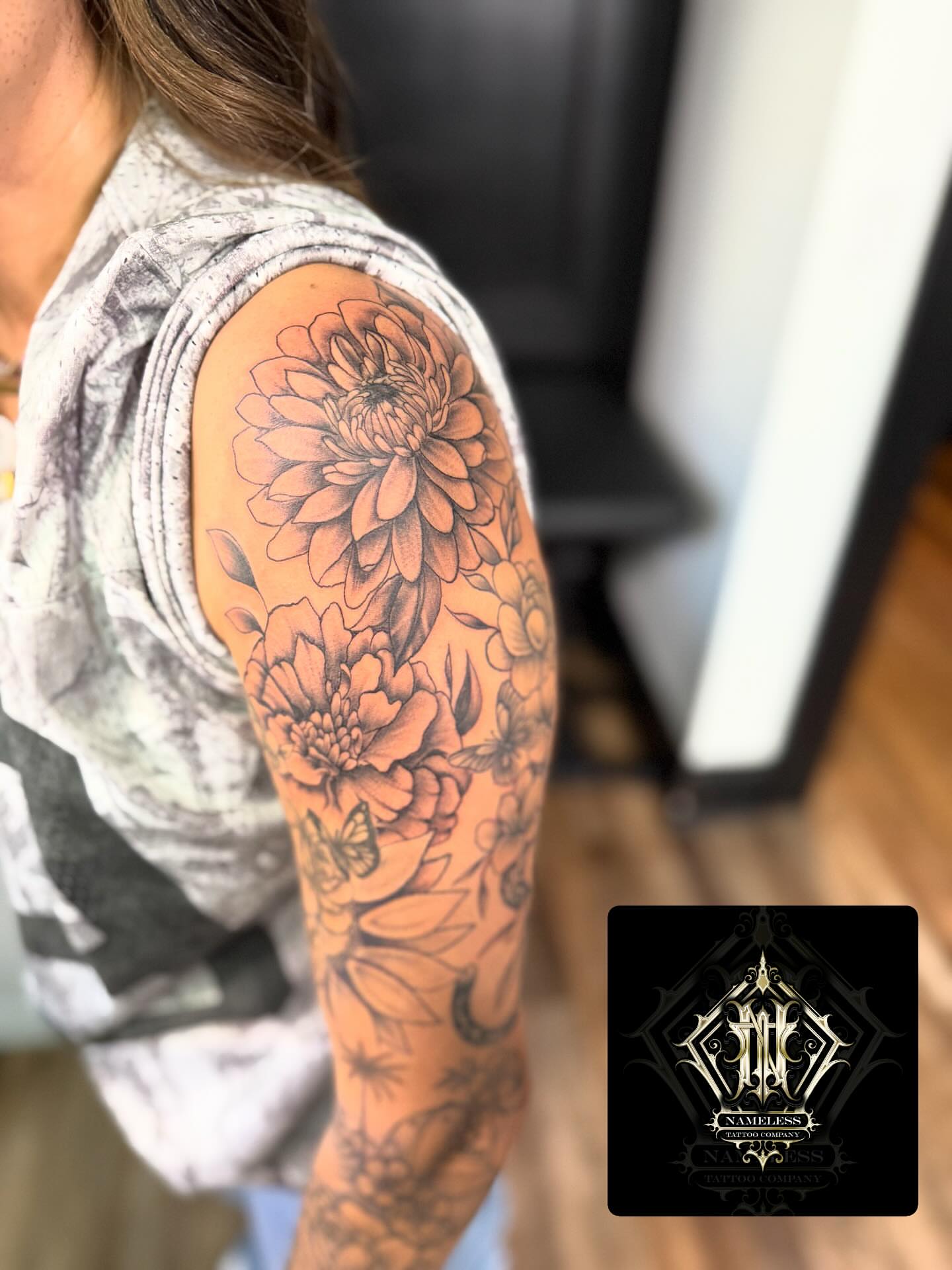 Floral bouquet realism tattoo on the shoulder by AJ