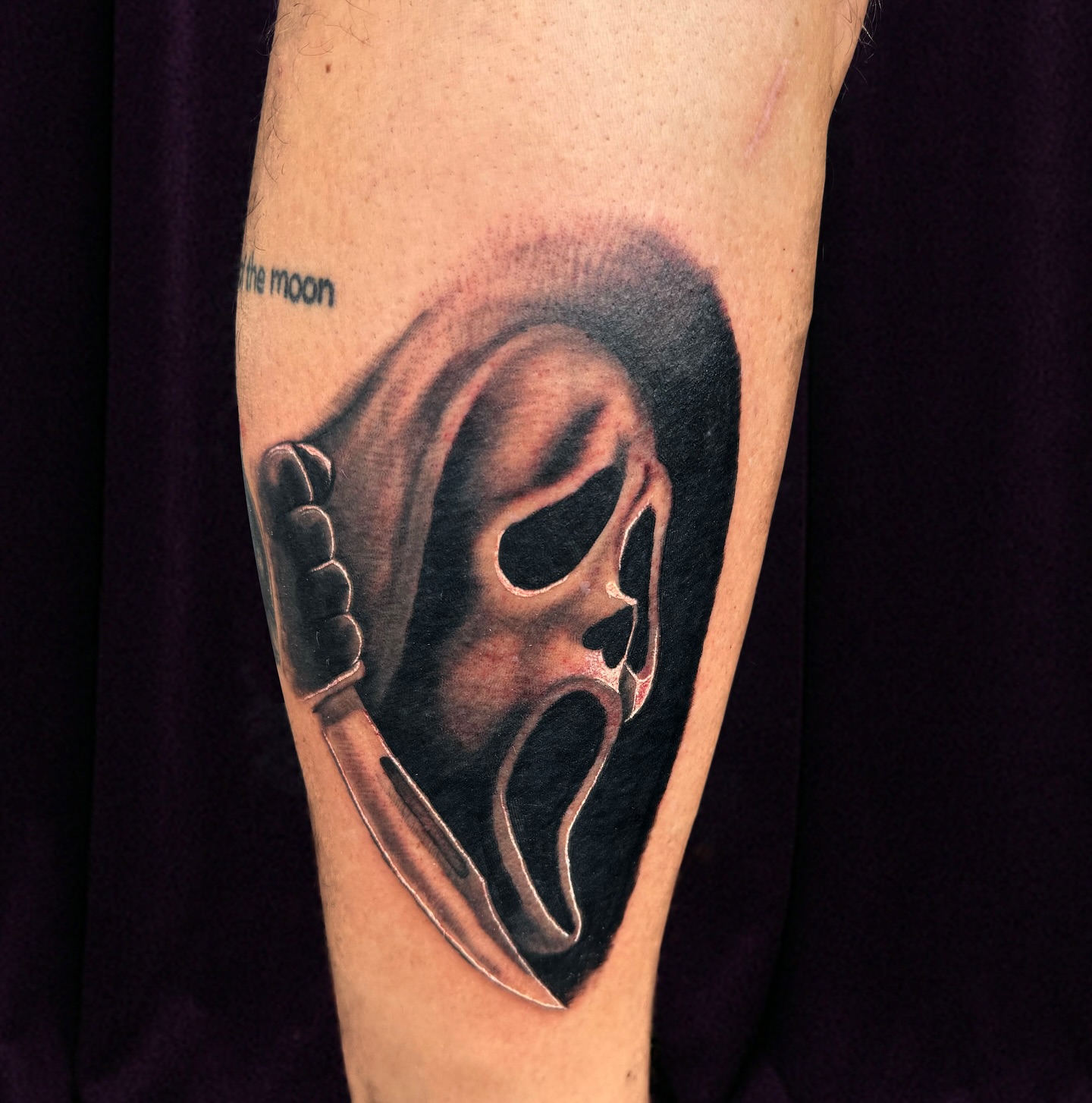 Mask with knife realism tattoo on the forearm by Nick Harrison, Dayton, Ohio
