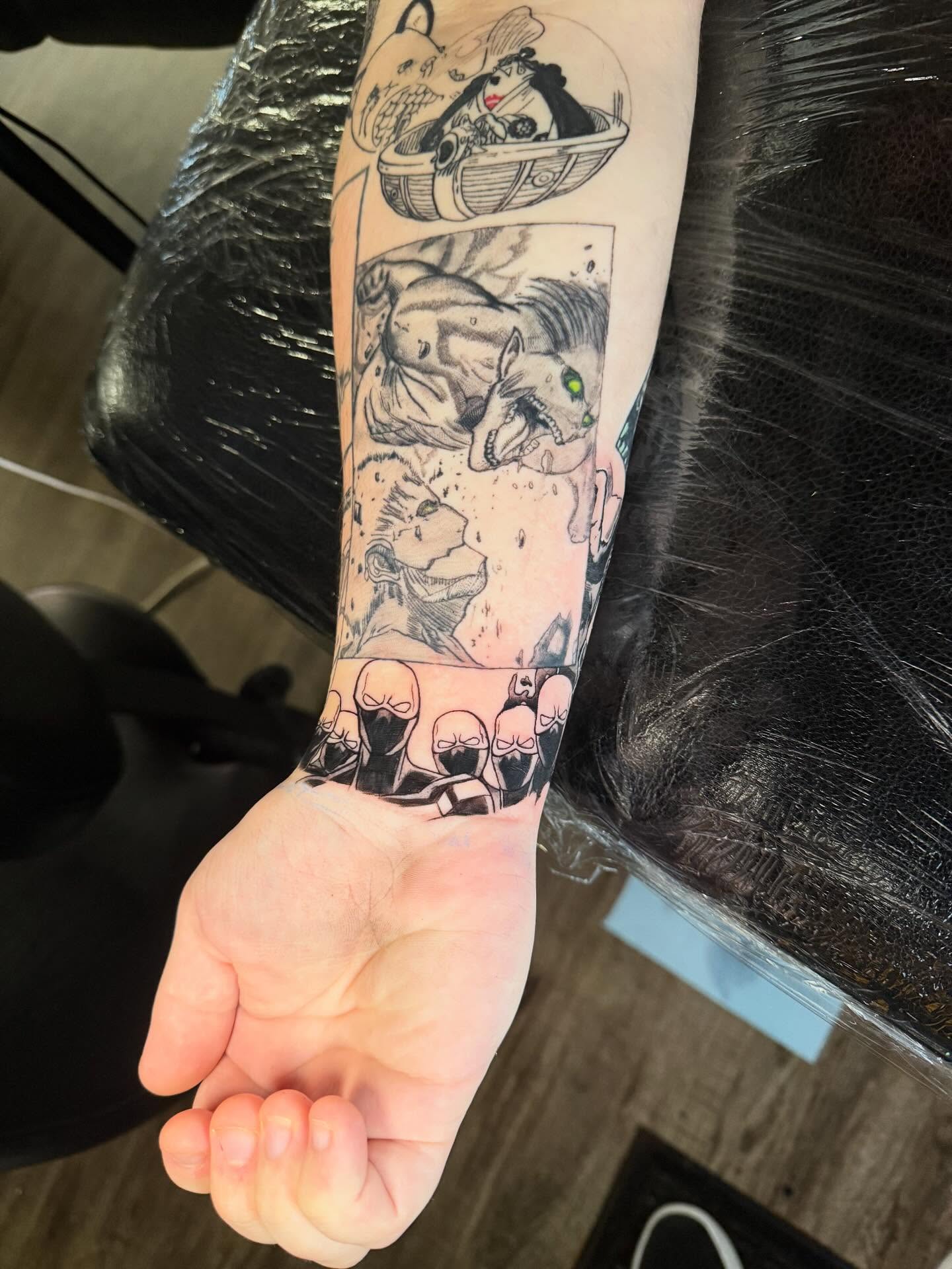 Anime characters anime tattoo on the forearm by Damon Moore