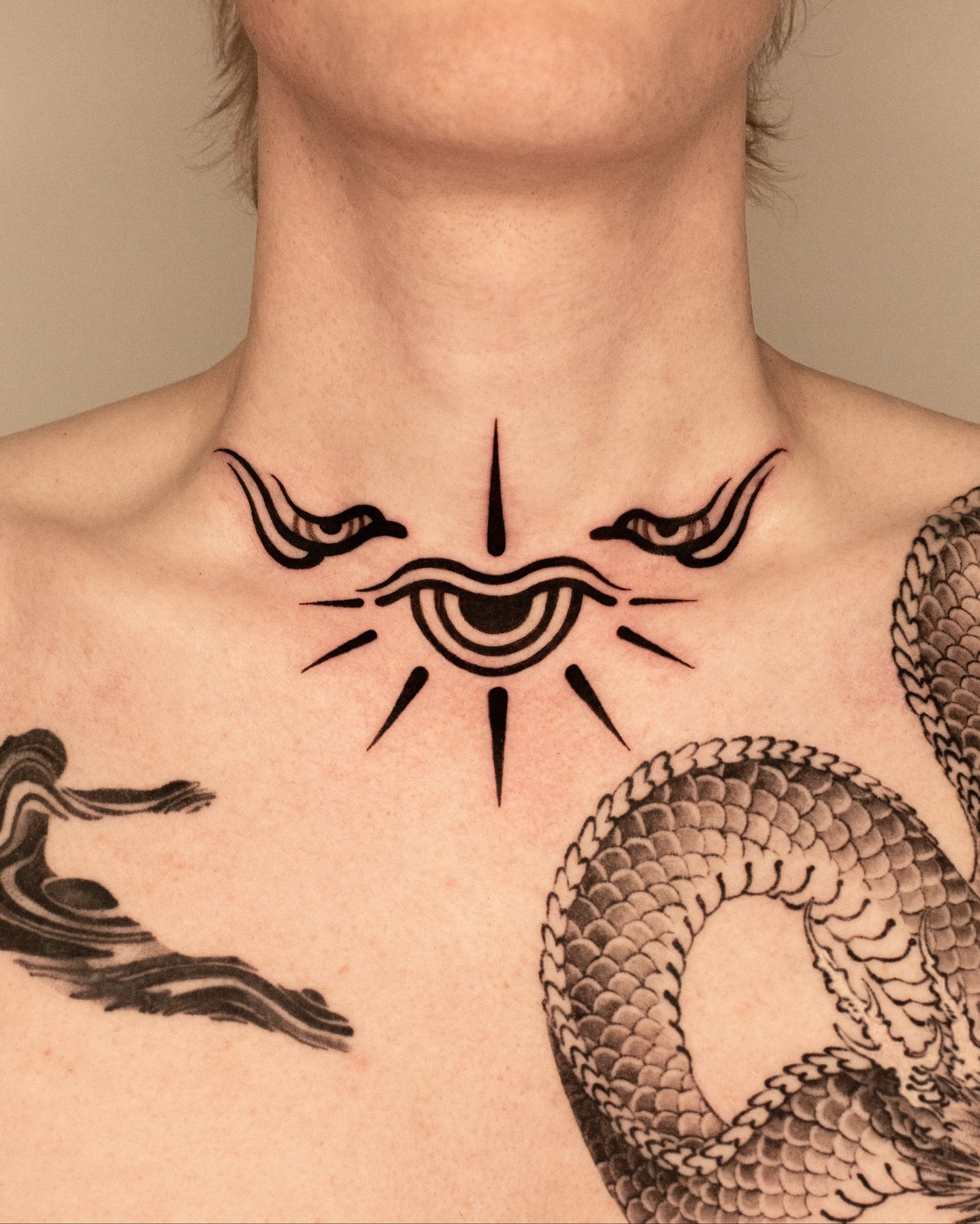 Eye with wings black and grey tattoo on the chest by Fisher Man