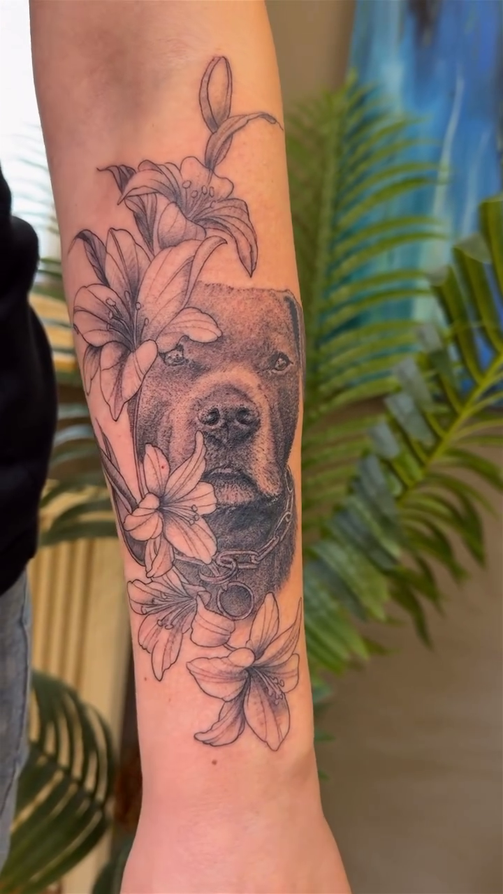 Dog and flowers realism tattoo by Die Ivo, Bielefeld, Germany